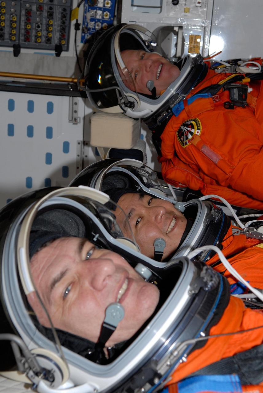 KENNEDY SPACE CENTER, FLA. -- Inside space shuttle Discovery, STS-120 Mission Specialists Paolo Nespoli, Daniel Tani and Scott Parazynski have been taking part in a simulated launch countdown, culmination of the prelaunch terminal countdown demonstration test, or TCDT. Nespoli represents the European Space Agency.  The TCDT at NASA's Kennedy Space Center provides astronauts and ground crews an opportunity to participate in various launch preparation activities, including equipment familiarization and emergency training. The STS-120 mission will deliver the U.S. Node 2 module, named Harmony, aboard space shuttle Discovery to the International Space Station.  Discovery is targeted to launch on its 14-day mission at 11:38 a.m. EDT on Oct. 23. Photo credit: NASA/Kim Shiflett