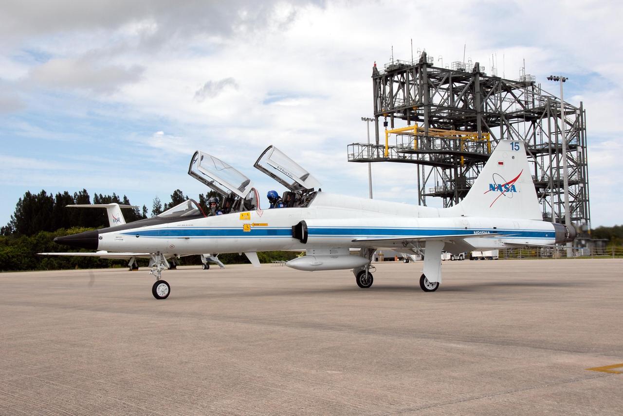 KENNEDY SPACE CENTER, FLA. -- The crew members of space shuttle mission STS-120 prepare for their return to NASA's Johnson Space Center in Houston following three days of terminal countdown demonstration test, or TCDT, activities.  At Kennedy Space Center's Shuttle Landing Facility, Commander Pam Melroy, in front, and Mission Specialist Stephanie Wilson complete the final tasks before takeoff in a T-38 jet aircraft. Melroy is the second woman to command a shuttle mission.  The TCDT provides astronauts and ground crews with equipment familiarization, emergency egress training and a simulated launch countdown. The STS-120 mission will deliver the U.S. Node 2 module, named Harmony, aboard space shuttle Discovery to the International Space Station on a 14-day mission.  Discovery's launch is targeted for Oct. 23 at 11:38 a.m. EDT.  Photo credit: NASA/Kim Shiflett