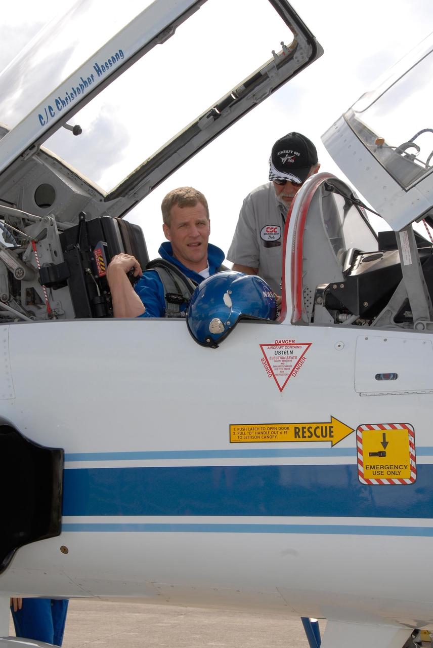 KENNEDY SPACE CENTER, FLA. -- The crew members of space shuttle mission STS-120 prepare for their return to NASA's Johnson Space Center in Houston following three days of terminal countdown demonstration test, or TCDT, activities.  At Kennedy Space Center's Shuttle Landing Facility, Mission Specialist Scott Parazynski is strapped into his T-38 jet aircraft prior to takeoff. The TCDT provides astronauts and ground crews with equipment familiarization, emergency egress training and a simulated launch countdown. The STS-120 mission will deliver the U.S. Node 2 module, named Harmony, aboard space shuttle Discovery to the International Space Station on a 14-day mission.  Discovery's launch is targeted for Oct. 23 at 11:38 a.m. EDT.  Photo credit: NASA/Kim Shiflett