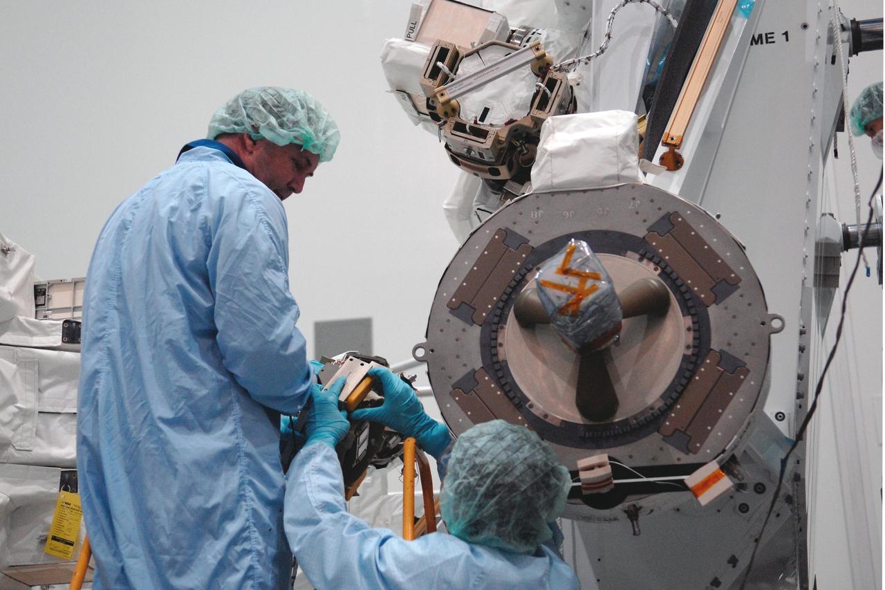 KENNEDY SPACE CENTER, FLA. -- In the Space Station Processing Facility at NASA's Kennedy Space Center, STS-123 crew members get a close look at hardware related to the mission. They are at the center for a crew equipment interface test, which allows familiarization with equipment they will use during the mission. Crew members are Commander Dominic Gorie, Pilot Gregory Johnson and Mission Specialists Richard Linnehan, Takao Doi, Robert Behnken, Gerrett Reisman and Michael Foreman. Doi represents the Japan Aerospace Exploration Agency. Reisman will remain on the space station after the mission as a flight engineer for Expedition 16. STS-123 will carry and install one of the components of the Japanese Experiment Module, or JEM. Known as Kibo, the JEM comprises six components: two research facilities -- the Pressurized Module and Exposed Facility; a Logistics Module attached to each of them; a Remote Manipulator System; and an Inter-Orbit Communication System unit. The various components of JEM will be assembled in space over the course of three space shuttle missions. The first of those three missions, STS-123, will carry the Experiment Logistics Module Pressurized Section aboard the space shuttle Endeavour, targeted for launch in February 2008. Photo credit: NASA/Dimitrios Gerondidakis