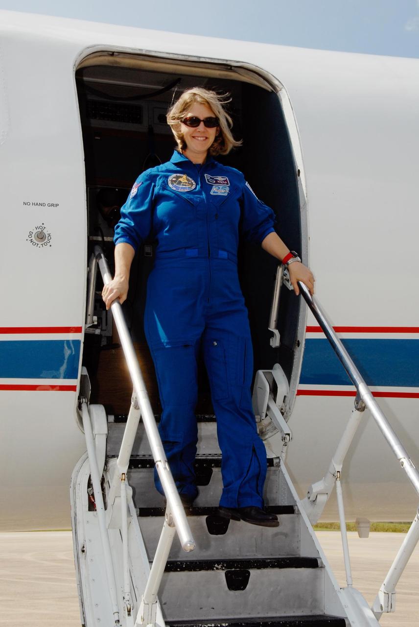 KENNEDY SPACE CENTER, FLA. --   STS-120  Commander Pamela Melroy exits the Shuttle Training Aircraft after arrival at NASA's Kennedy Space Center.  Melroy will be making her third shuttle flight, the second woman to command a shuttle mission.  The crew has returned to Kennedy to prepare for launch aboard space shuttle Discovery at 11:38 a.m. EDT on Oct. 23.  The mission will be the 23rd shuttle flight to the International Space Station, delivering the Italian-built U.S. Node 2, called Harmony.  The 14-day mission includes five spacewalks -- four by shuttle crew members and one by the station’s Expedition 16 crew -- to install Harmony and move the P6 solar arrays to their permanent position and deploy them.  Discovery is expected to complete its mission and return home at 4:47 a.m. EST on Nov. 6.   Photo credit: NASA/Kim Shiflett