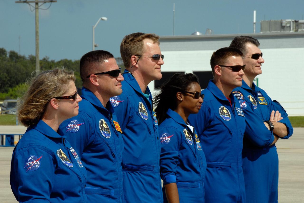 KENNEDY SPACE CENTER, FLA. -- After their arrival at the Shuttle Landing Facility of NASA's Kennedy Space Center, the STS-120 crew lines up for a photo. From left are From left are Commander Pamela Melroy, Pilot George Zamka and Mission Specialists Scott Parazynski, Stephanie Wilson, Doug Wheelock and Paolo Nespoli. Not pictured is Daniel Tani, who will be remaining on the International Space Station to join the Expedition 16 crew after the mission is complete. Nespoli represents the European Space Agency. The crew has returned to Kennedy to prepare for launch aboard space shuttle Discovery at 11:38 a.m. EDT on Oct. 23. The mission will be the 23rd shuttle flight to the International Space Station, delivering the Italian-built U.S. Node 2, called Harmony. The 14-day mission includes five spacewalks -- four by shuttle crew members and one by the station’s Expedition 16 crew -- to install Harmony and move the P6 solar arrays to their permanent position and deploy them. Discovery is expected to complete its mission and return home at 4:47 a.m. EST on Nov. 6. Photo credit: NASA/Kim Shiflett