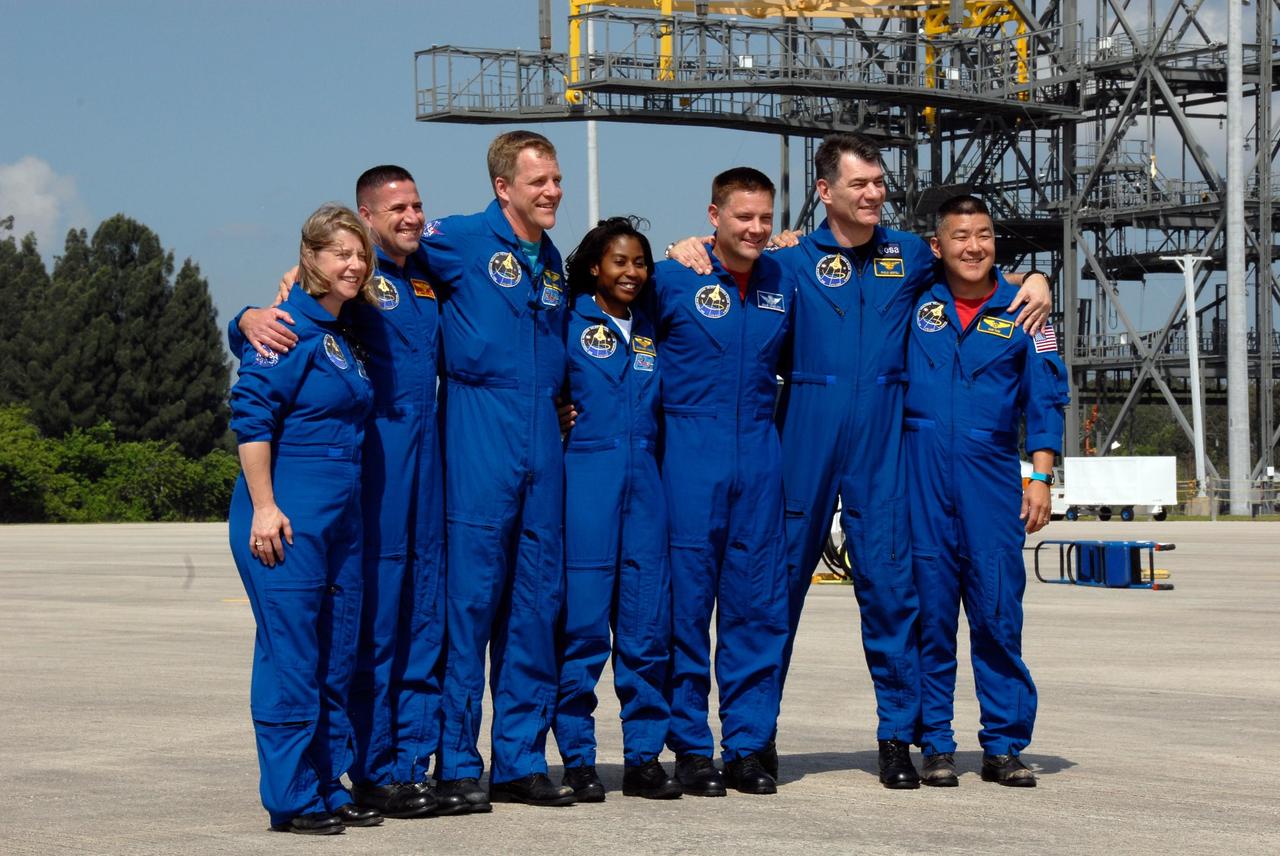 KENNEDY SPACE CENTER, FLA. -- After their arrival at the Shuttle Landing Facility of NASA's Kennedy Space Center, the STS-120 crew lines up for a photo. From left are From left are Commander Pamela Melroy, Pilot George Zamka and Mission Specialists Scott Parazynski, Stephanie Wilson, Doug Wheelock, Paolo Nespoli and Daniel Tani. Nespoli represents the European Space Agency. Tani will be remaining on the International Space Station to join the Expedition 16 crew after the mission is complete. The crew has returned to Kennedy to prepare for launch aboard space shuttle Discovery at 11:38 a.m. EDT on Oct. 23. The mission will be the 23rd shuttle flight to the International Space Station, delivering the Italian-built U.S. Node 2, called Harmony. The 14-day mission includes five spacewalks -- four by shuttle crew members and one by the station’s Expedition 16 crew -- to install Harmony and move the P6 solar arrays to their permanent position and deploy them. Discovery is expected to complete its mission and return home at 4:47 a.m. EST on Nov. 6. Photo credit: NASA/Kim Shiflett