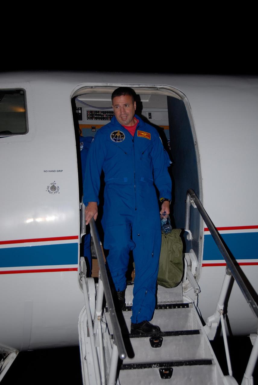 KENNEDY SPACE CENTER, FLA. -- STS-120 Pilot George Zamka disembarks from a Shuttle Training Aircraft, or STA, on the tarmac at Kennedy Space Center's Shuttle Landing Facility.  He and STS-120 Commander Pam Melroy were training for their upcoming space shuttle mission by practicing landings using the STA.  Melroy is the second woman to command a shuttle mission. Also assigned to STS-120 are Mission Specialists Scott Parazynski, Stephanie Wilson, Doug Wheelock, Paolo Nespoli and Daniel Tani. Nespoli represents the European Space Agency. Tani will remain on the International Space Station as an Expedition 16 flight engineer after the STS-120 mission is complete. The mission will be the 23rd shuttle flight to the International Space Station, delivering the Italian-built U.S. Node 2, called Harmony. The crew arrived at Kennedy on Oct. 19 to prepare for launch aboard space shuttle Discovery at 11:38 a.m. EDT Oct. 23. The 14-day mission includes five spacewalks -- four by shuttle crew members and one by the station's Expedition 16 crew -- to install Harmony and move the P6 solar arrays to their permanent position and deploy them. Discovery is expected to complete its mission and return home on Nov. 6.  Photo credit: NASA/Kim Shiflett