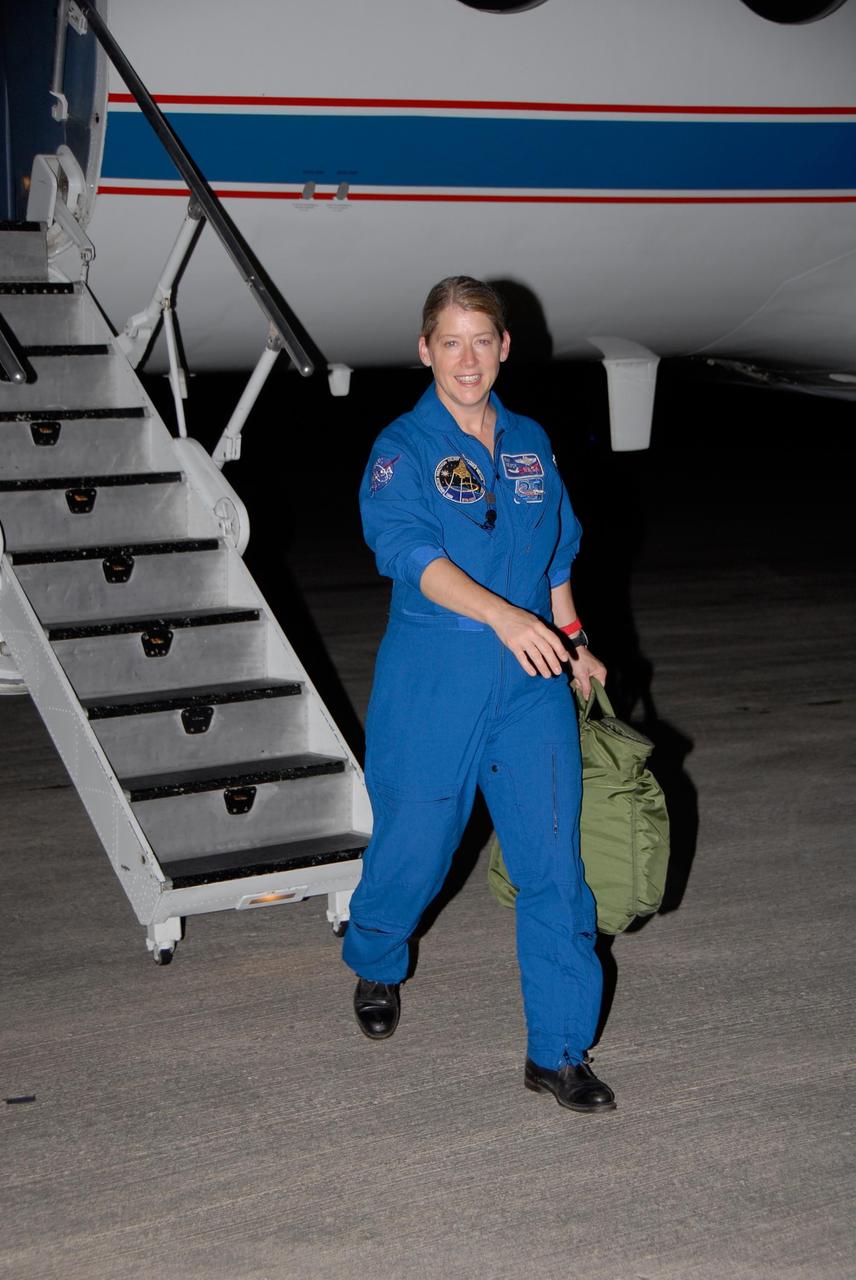 KENNEDY SPACE CENTER, FLA. -- STS-120 Commander Pam Melroy disembarks from a Shuttle Training Aircraft, or STA, on the tarmac at Kennedy Space Center's Shuttle Landing Facility.  She and STS-120 Pilot George Zamka were training for their upcoming space shuttle mission by practicing landings using the STA.  Melroy is the second woman to command a shuttle mission. Also assigned to STS-120 are Mission Specialists Scott Parazynski, Stephanie Wilson, Doug Wheelock, Paolo Nespoli and Daniel Tani. Nespoli represents the European Space Agency. Tani will remain on the International Space Station as an Expedition 16 flight engineer after the STS-120 mission is complete. The mission will be the 23rd shuttle flight to the International Space Station, delivering the Italian-built U.S. Node 2, called Harmony. The crew arrived at Kennedy on Oct. 19 to prepare for launch aboard space shuttle Discovery at 11:38 a.m. EDT Oct. 23. The 14-day mission includes five spacewalks -- four by shuttle crew members and one by the station's Expedition 16 crew -- to install Harmony and move the P6 solar arrays to their permanent position and deploy them. Discovery is expected to complete its mission and return home on Nov. 6.  Photo credit: NASA/Kim Shiflett