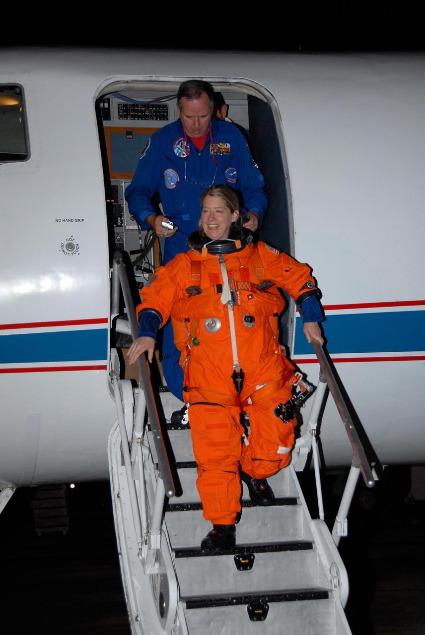 KENNEDY SPACE CENTER, FLA. -- STS-120 Commander Pam Melroy disembarks from a Shuttle Training Aircraft, or STA, at NASA Kennedy Space Center's Shuttle Landing Facility.  She and STS-120 Pilot George Zamka were training for their upcoming space shuttle mission by practicing landings in STAs.  Melroy is the second woman to command a shuttle mission. Also assigned to STS-120 are Mission Specialists Scott Parazynski, Stephanie Wilson, Doug Wheelock, Paolo Nespoli and Daniel Tani. Nespoli represents the European Space Agency. Tani will remain on the International Space Station as an Expedition 16 flight engineer after the STS-120 mission is complete. The mission will be the 23rd shuttle flight to the International Space Station, delivering the Italian-built U.S. Node 2, called Harmony. The crew arrived at Kennedy on Oct. 19 to prepare for launch aboard space shuttle Discovery at 11:38 a.m. EDT Oct. 23. The 14-day mission includes five spacewalks -- four by shuttle crew members and one by the station's Expedition 16 crew -- to install Harmony and move the P6 solar arrays to their permanent position and deploy them. Discovery is scheduled to complete its mission and return home on Nov. 6.  Photo credit: NASA/Kim Shiflett