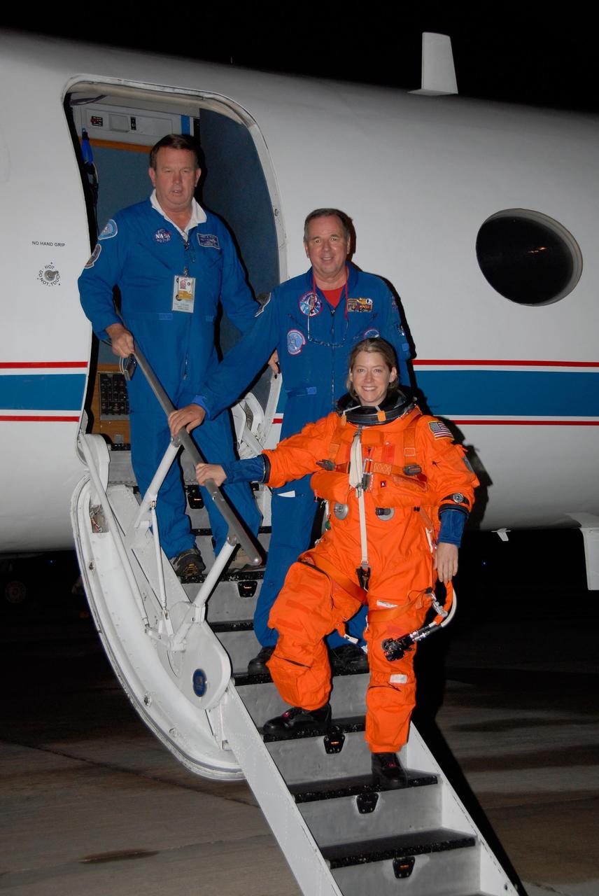 KENNEDY SPACE CENTER, FLA. -- STS-120 Commander Pam Melroy and her flight crew disembark from a Shuttle Training Aircraft, or STA, at NASA Kennedy Space Center's Shuttle Landing Facility.  She and STS-120 Pilot George Zamka were training for their upcoming space shuttle mission by practicing landings in STAs.  Melroy is the second woman to command a shuttle mission. Also assigned to STS-120 are Mission Specialists Scott Parazynski, Stephanie Wilson, Doug Wheelock, Paolo Nespoli and Daniel Tani. Nespoli represents the European Space Agency. Tani will remain on the International Space Station as an Expedition 16 flight engineer after the STS-120 mission is complete. The mission will be the 23rd shuttle flight to the International Space Station, delivering the Italian-built U.S. Node 2, called Harmony. The crew arrived at Kennedy on Oct. 19 to prepare for launch aboard space shuttle Discovery at 11:38 a.m. EDT Oct. 23. The 14-day mission includes five spacewalks -- four by shuttle crew members and one by the station's Expedition 16 crew -- to install Harmony and move the P6 solar arrays to their permanent position and deploy them. Discovery is scheduled to complete its mission and return home on Nov. 6.  Photo credit: NASA/Kim Shiflett
