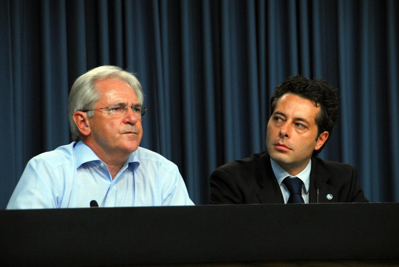 KENNEDY SPACE CENTER, FLA. -- Alan Thirkettle, the International Space Station Program Manager for ESA, the European Space Agency, and Mauro Piermaria, the ESPERIA mission manager for ASI, the Italian Space Agency, participate in a news briefing on the launch readiness of space shuttle mission STS-120.  The STS-120 mission will be the 23rd shuttle flight to the International Space Station, delivering the Italian-built U.S. Node 2, called Harmony. The seven-member crew includes ESA astronaut Paolo Nespoli from Italy. The 14-day mission includes five spacewalks -- four by shuttle crew members and one by the station's Expedition 16 crew -- to install Harmony and move the P6 solar arrays to their permanent position and deploy them. Launch aboard space shuttle Discovery is planned for 11:38 a.m. EDT Oct. 23, and Discovery is scheduled to complete its mission and return home on Nov. 6.  Photo credit: NASA/George Shelton