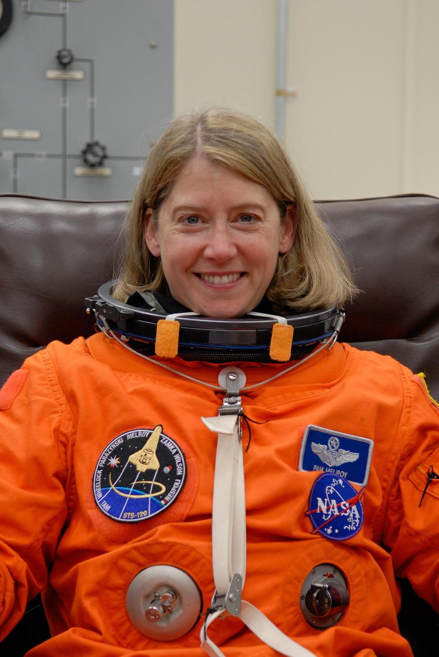 KENNEDY SPACE CENTER, FLA. --  At NASA's Kennedy Space Center, the STS-120 crew don their launch and entry suits before heading to Launch Pad 39A for launch aboard space shuttle Discovery to the International Space Station.  Seen here is Commander Pamela Melroy, who is making her third shuttle flight.  She is only the second woman to command a shuttle mission.  Discovery is scheduled for liftoff at 11:38 a.m. EDT.  The mission will be the 23rd assembly flight to the space station and the 34th flight for Discovery.  Payload on the mission is the Italian-built U.S. Node 2, called Harmony.  During the 14-day mission, the crew will install Harmony and move the P6 solar arrays to their permanent position and deploy them.  Discovery is expected to complete its mission and return home at 4:47 a.m. EST on Nov. 6. Photo credit: NASA/Kim Shiflett