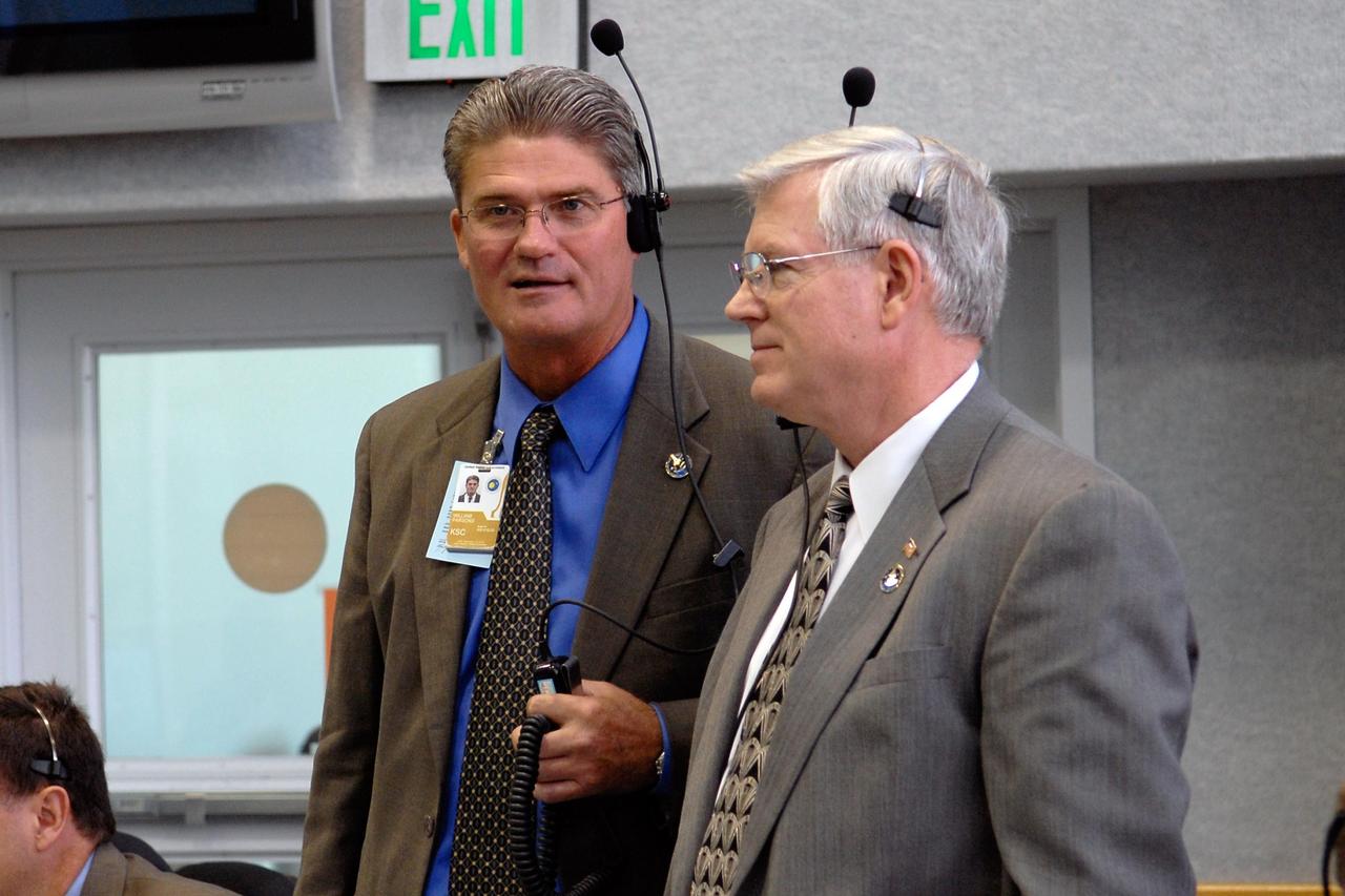 KENNEDY SPACE CENTER, FLA. -- In the firing room of the Launch Control Center at NASA's Kennedy Space Center, KSC Director Bill Parsons (left) and Johnson Space Center Director Michael Coats wait for the final countdown of space shuttle Discovery on mission STS-120. Liftoff was on time at 11:38:19 a.m. EDT. Discovery carries the Italian-built U.S. Node 2, called Harmony. During the 14-day STS-120 mission, the crew will install Harmony and move the P6 solar arrays to their permanent position and deploy them. Discovery is expected to complete its mission and return home at 4:47 a.m. EST on Nov. 6. Photo credit: NASA/Kim Shiflett