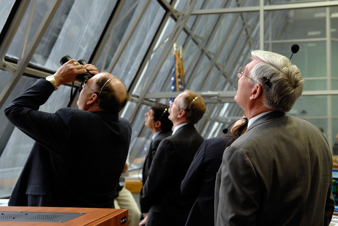 KENNEDY SPACE CENTER, FLA. --  In the firing room of the Launch Control Center at NASA's Kennedy Space Center, all eyes are on the successful launch of space shuttle Discovery on mission STS-120.  From left are Space Shuttle Program Manager Wayne Hale, Associate Administrator for NASA Space Operations William Gerstenmaier, NASA Flow Director Stephanie Stilson and Johnson Space Center Director Michael Coats. Liftoff was on time at 11:38:19 a.m. EDT.  Liftoff was on time at 11:38:19 a.m. EDT.  Discovery carries the Italian-built U.S. Node 2, called Harmony.  During the 14-day STS-120 mission, the crew will install Harmony and move the P6 solar arrays to their permanent position and deploy them. Discovery is expected to complete its mission and return home at 4:47 a.m. EST on Nov. 6. Photo credit: NASA/Kim Shiflett