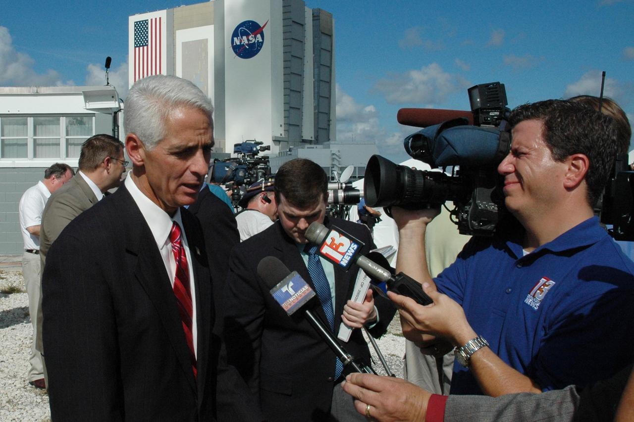 KENNEDY SPACE CENTER, FLA. -- Florida Governor Charlie Crist, left, is interviewed by reporters after the governor watched the successful launch of space shuttle Discovery on mission STS-120 to the International Space Station. Liftoff was on time at 11:38:19 a.m. EDT. Discovery carries the Italian-built U.S. Node 2, called Harmony. During the 14-day STS-120 mission, the crew will install Harmony and move the P6 solar arrays to their permanent position and deploy them. Discovery is expected to complete its mission and return home at 4:47 a.m. EST on Nov. 6. Photo credit: NASA/Troy Cryder