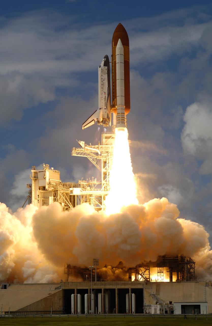 KENNEDY SPACE CENTER, FLA. --  As if rising from a bed of clouds, space shuttle Discovery leaps toward the sky, propelled by columns of fire from the solid rocket boosters, from Launch Pad 39A at NASA's Kennedy Space Center.  Liftoff was on time at 11:38:19 a.m. EDT.  Discovery carries the Italian-built U.S. Node 2, called Harmony.  During the 14-day STS-120 mission, the crew will install Harmony and move the P6 solar arrays to their permanent position and deploy them. Discovery is expected to complete its mission and return home at 4:47 a.m. EST on Nov. 6. Photo courtesy of Nikon/Scott Andrews