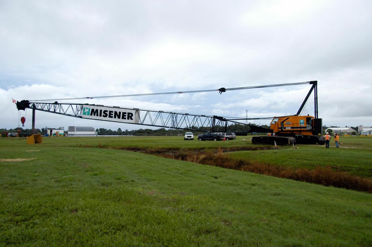 KENNEDY SPACE CENTER, FLA. -- A large crawler crane begins moving away from the turn basin at the Launch Complex 39 Area on NASA's Kennedy Space Center. The crane with its 70-foot boom will be moved to Launch Pad 39B and used to construct a new lightning protection system for the Constellation Program and Ares/Orion launches. Pad B will be the site of the first Ares vehicle launch, including Ares I-X which is scheduled for April 2009. Photo credit: NASA/George Shelton