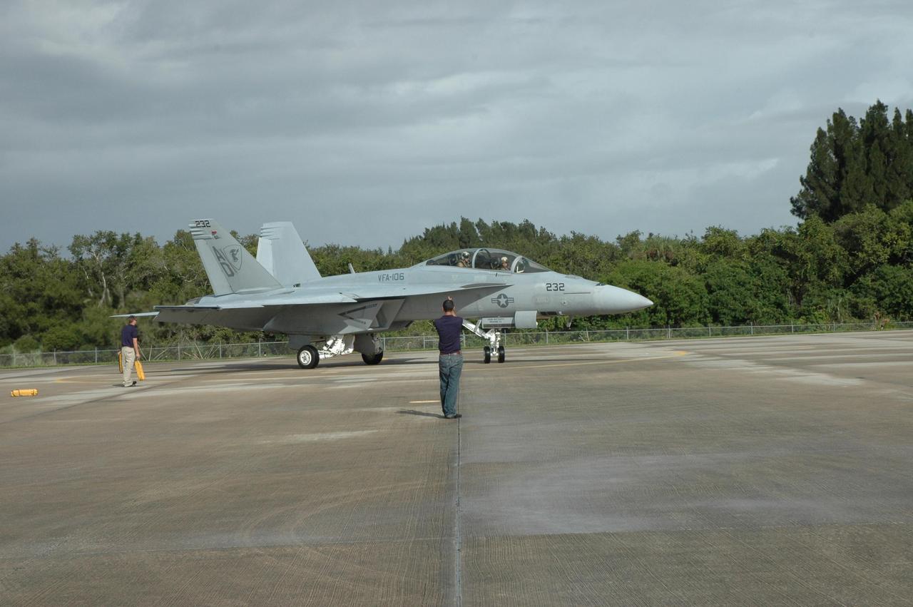 KENNEDY SPACE CENTER, FLA. -- A U.S. Navy F-18 Super Hornet arrives at the Shuttle Landing Facility at NASA's Kennedy Space Center.  Several of the planes are participating in the World Space Expo being held from Nov. 1 to Nov. 4 at the NASA Kennedy Space Center Visitor Complex.  Other aircraft joining in the salute include U.S. Air Force Thunderbirds Aerial Demonstration Squadron , U.S. Air Force F-22 Raptor,  U.S. Air Force F-15 Eagle, the P-51 Mustang Heritage Flight and the U.S. Air Force 920th Rescue Wing, which was responsible for Mercury and Gemini capsule recovery.   The U.S. Army Golden Knights also will demonstrate precision skydiving.  The World Space Expo is an event to commemorate humanity's first 50 years in space while looking forward to returning people to the moon and exploring beyond. The expo will showcase various panels, presentations and educational programs. It also is a part of NASA's 50th anniversary celebrations, highlighting the 45th Anniversary of the Mercury Program celebration featuring original NASA astronauts John Glenn and Scott Carpenter and the Pioneering Women of Aerospace forum featuring Eileen Collins and other prominent female space veterans. The agency was founded Oct. 1, 1958.  Photo credit: NASA/Jack Pfaller