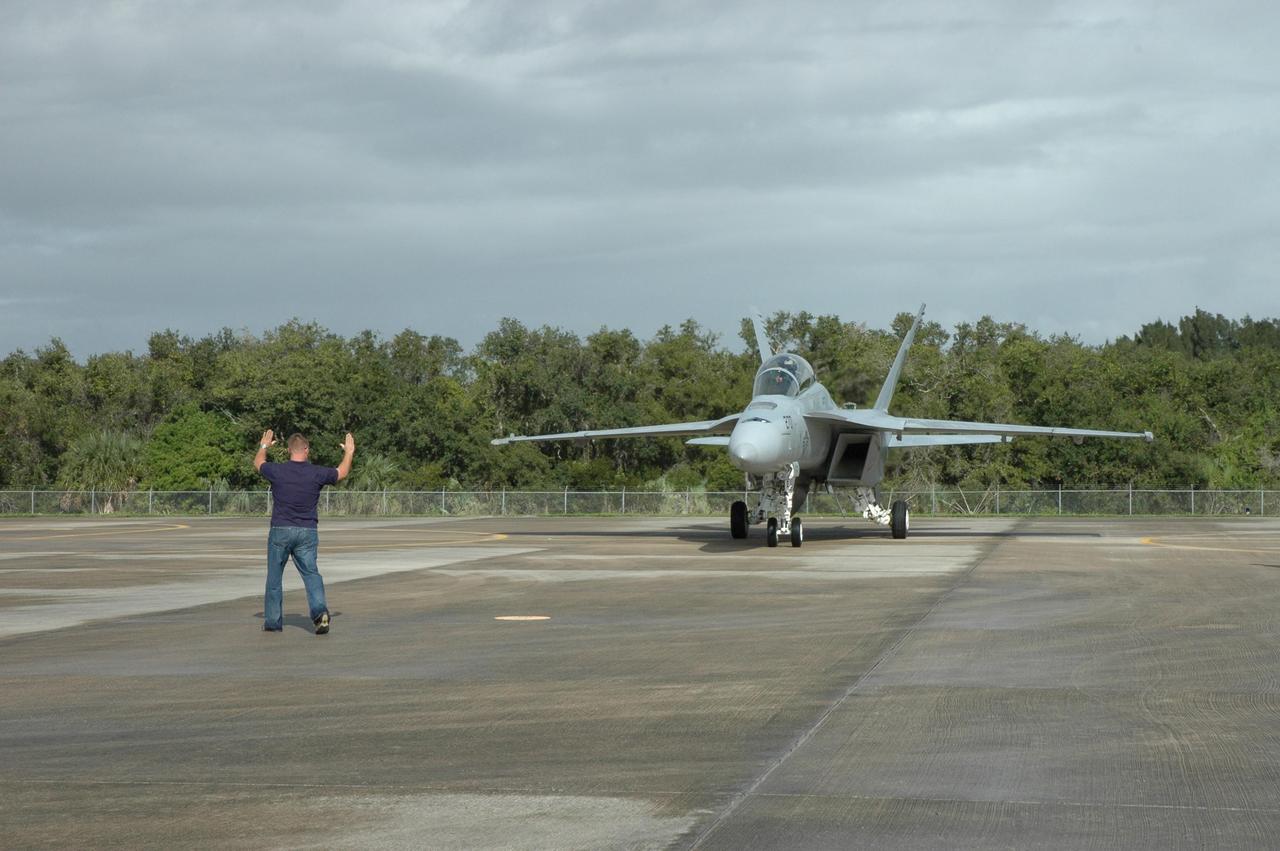 KENNEDY SPACE CENTER, FLA. -- A U.S. Navy F-18 Super Hornet is parked on the Shuttle Landing Facility at NASA's Kennedy Space Center.  Several of the planes are participating in the World Space Expo being held from Nov. 1 to Nov. 4 at the NASA Kennedy Space Center Visitor Complex.  Other aircraft joining in the salute include U.S. Air Force Thunderbirds Aerial Demonstration Squadron , U.S. Air Force F-22 Raptor,  U.S. Air Force F-15 Eagle, the P-51 Mustang Heritage Flight and the U.S. Air Force 920th Rescue Wing, which was responsible for Mercury and Gemini capsule recovery.  The U.S. Army Golden Knights also will demonstrate precision skydiving.  The World Space Expo is an event to commemorate humanity's first 50 years in space while looking forward to returning people to the moon and exploring beyond. The expo will showcase various panels, presentations and educational programs. It also is a part of NASA's 50th anniversary celebrations, highlighting the 45th Anniversary of the Mercury Program celebration featuring original NASA astronauts John Glenn and Scott Carpenter and the Pioneering Women of Aerospace forum featuring Eileen Collins and other prominent female space veterans. The agency was founded Oct. 1, 1958.  Photo credit: NASA/Jack Pfaller
