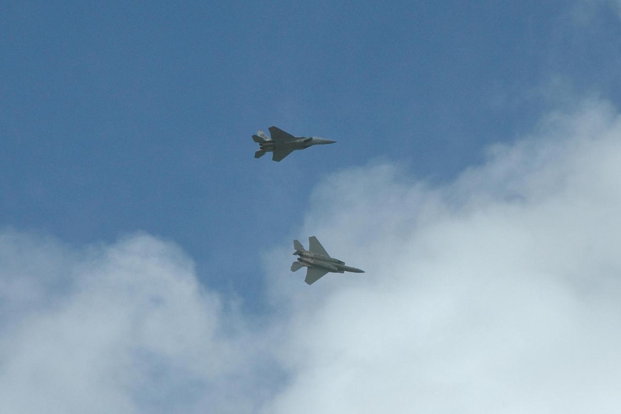 KENNEDY SPACE CENTER, FLA. -- Two of the U.S. Navy F-18 Super Hornets practice their maneuvers over NASA's Kennedy Space Center.  The jets are participating in the World Space Expo being held from Nov. 1 to Nov. 4 at the NASA Kennedy Space Center Visitor Complex.  Other aircraft joining in the salute include U.S. Air Force Thunderbirds Aerial Demonstration Squadron , U.S. Air Force F-22 Raptor,  U.S. Air Force F-15 Eagle, the P-51 Mustang Heritage Flight and the U.S. Air Force 920th Rescue Wing, which was responsible for Mercury and Gemini capsule recovery.  The U.S. Army Golden Knights also will demonstrate precision skydiving.  The World Space Expo is an event to commemorate humanity's first 50 years in space while looking forward to returning people to the moon and exploring beyond. The expo will showcase various panels, presentations and educational programs. It also is a part of NASA's 50th anniversary celebrations, highlighting the 45th Anniversary of the Mercury Program celebration featuring original NASA astronauts John Glenn and Scott Carpenter and the Pioneering Women of Aerospace forum featuring Eileen Collins and other prominent female space veterans. The agency was founded Oct. 1, 1958.  Photo credit: NASA/Jack Pfaller