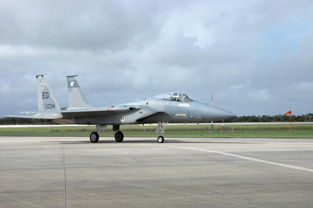 KENNEDY SPACE CENTER, FLA. -- A U.S. Air Force F-15 Eagle arrives at the Shuttle Landing Facility at NASA's Kennedy Space Center.  Several of the planes are participating in the World Space Expo being held from Nov. 1 to Nov. 4 at the NASA Kennedy Space Center Visitor Complex.  Other aircraft joining in the salute include U.S. Air Force Thunderbirds Aerial Demonstration Squadron, U.S. Navy F-18 Super Hornets, U.S. Air Force F-22 Raptor, the P-51 Mustang Heritage Flight and the U.S. Air Force 920th Rescue Wing, which was responsible for Mercury and Gemini capsule recovery.   The U.S. Army Golden Knights also will demonstrate precision skydiving.  The World Space Expo is an event to commemorate humanity's first 50 years in space while looking forward to returning people to the moon and exploring beyond. The expo will showcase various panels, presentations and educational programs. It also is a part of NASA's 50th anniversary celebrations, highlighting the 45th Anniversary of the Mercury Program celebration featuring original NASA astronauts John Glenn and Scott Carpenter and the Pioneering Women of Aerospace forum featuring Eileen Collins and other prominent female space veterans. The agency was founded Oct. 1, 1958.  Photo credit: NASA/Jack Pfaller
