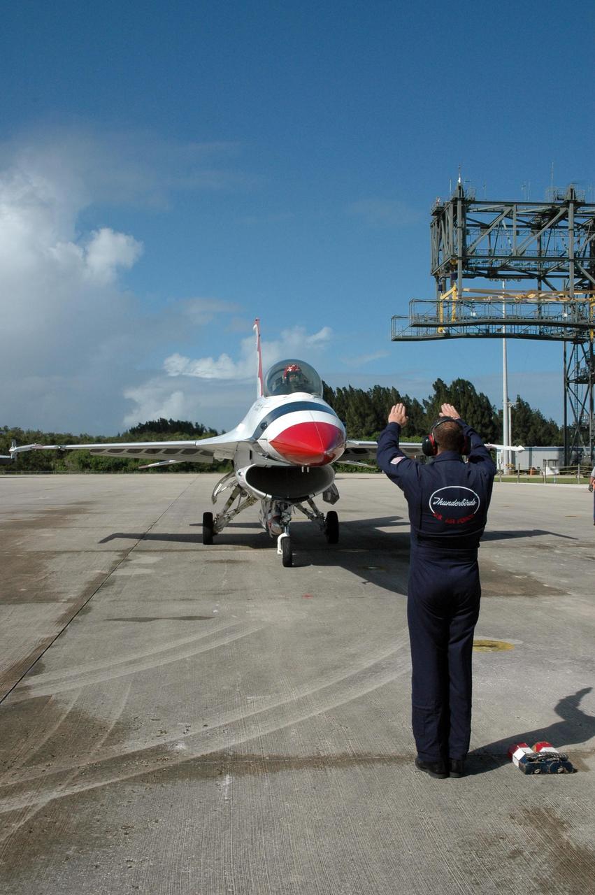 KENNEDY SPACE CENTER, FLA. -- Another of the U.S. Air Force Thunderbirds lands at the Shuttle Landing Facility at NASA's Kennedy Space Center.  The aerial demonstration squadron is performing for the World Space Expo being held from Nov. 1 to Nov. 4 at the NASA Kennedy Space Center Visitor Complex.  Other aircraft participating in the salute include U.S. Air Force F-22 Raptor, U.S. Navy F-18 Super Hornet, U.S. Air Force F-15 Eagle, the P-51 Mustang Heritage Flight and the U.S. Air Force 920th Rescue Wing, which was responsible for Mercury and Gemini capsule recovery.  The U.S. Army Golden Knights also will demonstrate precision skydiving.  The World Space Expo is an event to commemorate humanity's first 50 years in space while looking forward to returning people to the moon and exploring beyond. The expo will showcase various panels, presentations and educational programs. It also is a part of NASA's 50th anniversary celebrations, highlighting the 45th Anniversary of the Mercury Program celebration featuring original NASA astronauts John Glenn and Scott Carpenter and the Pioneering Women of Aerospace forum featuring Eileen Collins and other prominent female space veterans. The agency was founded Oct. 1, 1958.  Photo credit: NASA/Jack Pfaller