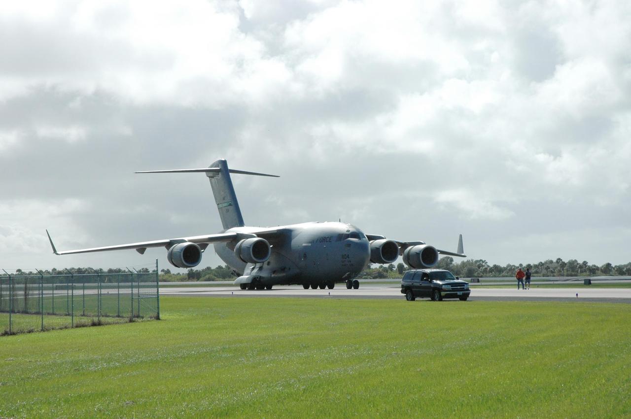 KENNEDY SPACE CENTER, FLA. -- A C-17 lands on the Shuttle Landing Facility at NASA's Kennedy Space Center.  The plane is providing support for the aerial show being performed for the World Space Expo being held from Nov. 1 to Nov. 4 at the NASA Kennedy Space Center Visitor Complex.  Aircraft participating are the U.S. Air Force Thunderbirds, U.S. Air Force F-22 Raptor, U.S. Navy F-18 Super Hornet, U.S. Air Force F-15 Eagle, the P-51 Mustang Heritage Flight and the U.S. Air Force 920th Rescue Wing, which was responsible for Mercury and Gemini capsule recovery.  The U.S. Army Golden Knights also will demonstrate precision skydiving.  The World Space Expo is an event to commemorate humanity's first 50 years in space while looking forward to returning people to the moon and exploring beyond. The expo will showcase various panels, presentations and educational programs. It also is a part of NASA's 50th anniversary celebrations, highlighting the 45th Anniversary of the Mercury Program celebration featuring original NASA astronauts John Glenn and Scott Carpenter and the Pioneering Women of Aerospace forum featuring Eileen Collins and other prominent female space veterans. The agency was founded Oct. 1, 1958.  Photo credit: NASA/Jack Pfaller
