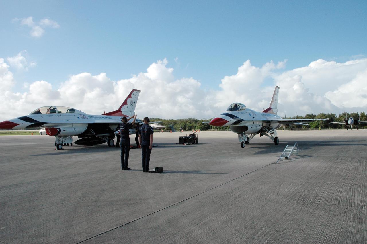 KENNEDY SPACE CENTER, FLA. -- Another of the U.S. Air Force Thunderbirds is parked on the Shuttle Landing Facility at NASA's Kennedy Space Center.  The aerial demonstration squadron is performing for the World Space Expo being held from Nov. 1 to Nov. 4 at the NASA Kennedy Space Center Visitor Complex.  Other aircraft participating in the salute include U.S. Air Force F-22 Raptor, U.S. Navy F-18 Super Hornet, U.S. Air Force F-15 Eagle, the P-51 Mustang Heritage Flight and the U.S. Air Force 920th Rescue Wing, which was responsible for Mercury and Gemini capsule recovery.  The U.S. Army Golden Knights also will demonstrate precision skydiving.  The World Space Expo is an event to commemorate humanity's first 50 years in space while looking forward to returning people to the moon and exploring beyond. The expo will showcase various panels, presentations and educational programs. It also is a part of NASA's 50th anniversary celebrations, highlighting the 45th Anniversary of the Mercury Program celebration featuring original NASA astronauts John Glenn and Scott Carpenter and the Pioneering Women of Aerospace forum featuring Eileen Collins and other prominent female space veterans. The agency was founded Oct. 1, 1958.  Photo credit: NASA/Jack Pfaller