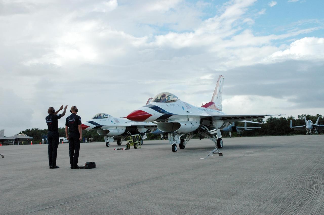 KENNEDY SPACE CENTER, FLA. -- U.S. Air Force Thunderbirds line up on the Shuttle Landing Facility at NASA's Kennedy Space Center.  The aerial demonstration squadron is performing for the World Space Expo being held from Nov. 1 to Nov. 4 at the NASA Kennedy Space Center Visitor Complex.  Other aircraft participating in the salute include U.S. Air Force F-22 Raptor, U.S. Navy F-18 Super Hornet, U.S. Air Force F-15 Eagle, the P-51 Mustang Heritage Flight and the U.S. Air Force 920th Rescue Wing, which was responsible for Mercury and Gemini capsule recovery.  The U.S. Army Golden Knights also will demonstrate precision skydiving.  The World Space Expo is an event to commemorate humanity's first 50 years in space while looking forward to returning people to the moon and exploring beyond. The expo will showcase various panels, presentations and educational programs. It also is a part of NASA's 50th anniversary celebrations, highlighting the 45th Anniversary of the Mercury Program celebration featuring original NASA astronauts John Glenn and Scott Carpenter and the Pioneering Women of Aerospace forum featuring Eileen Collins and other prominent female space veterans. The agency was founded Oct. 1, 1958.  Photo credit: NASA/Jack Pfaller
