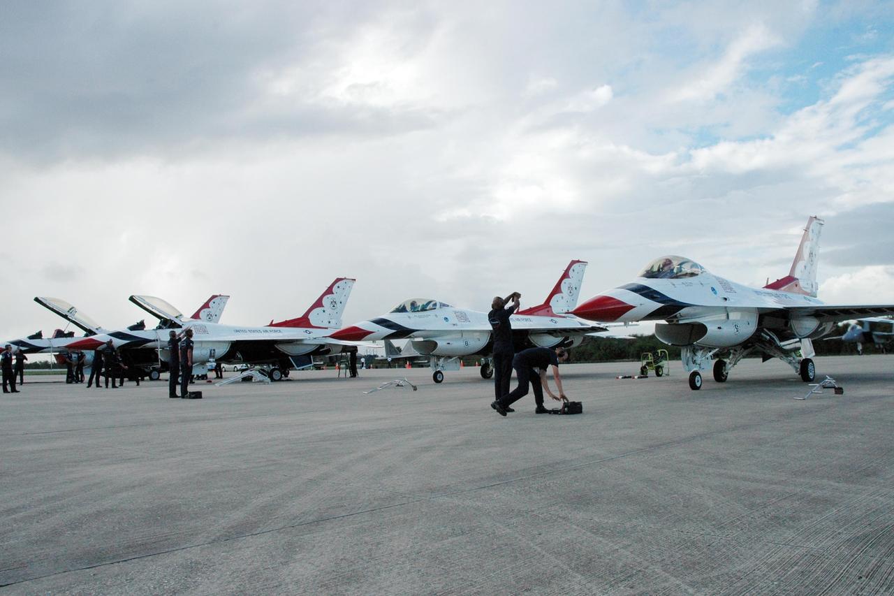 KENNEDY SPACE CENTER, FLA. -- U.S. Air Force Thunderbirds line up on the Shuttle Landing Facility at NASA's Kennedy Space Center.  The aerial demonstration squadron is performing for the World Space Expo being held from Nov. 1 to Nov. 4 at the NASA Kennedy Space Center Visitor Complex.  Other aircraft participating in the salute include U.S. Air Force F-22 Raptor, U.S. Navy F-18 Super Hornet, U.S. Air Force F-15 Eagle, the P-51 Mustang Heritage Flight and the U.S. Air Force 920th Rescue Wing, which was responsible for Mercury and Gemini capsule recovery.  The U.S. Army Golden Knights also will demonstrate precision skydiving.  The World Space Expo is an event to commemorate humanity's first 50 years in space while looking forward to returning people to the moon and exploring beyond. The expo will showcase various panels, presentations and educational programs. It also is a part of NASA's 50th anniversary celebrations, highlighting the 45th Anniversary of the Mercury Program celebration featuring original NASA astronauts John Glenn and Scott Carpenter and the Pioneering Women of Aerospace forum featuring Eileen Collins and other prominent female space veterans. The agency was founded Oct. 1, 1958.  Photo credit: NASA/Jack Pfaller