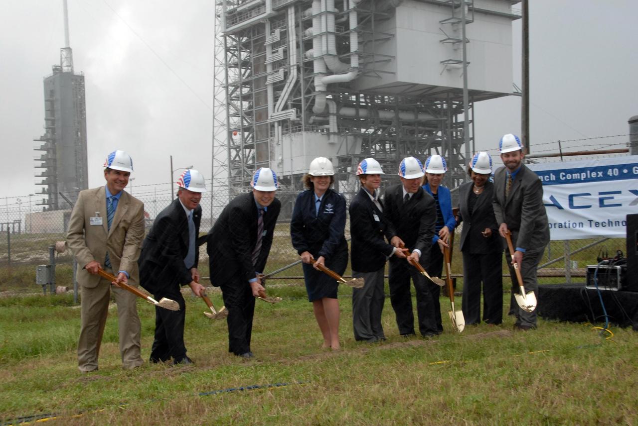 KENNEDY SPACE CENTER, FLA. --  Ready to put spades to work at ground-breaking ceremonies for SpaceX's new Falcon 9 rocket launch facilities at Space Launch Complex 40 at Cape Canaveral are (from left) Thad Altman, Florida State representative; Jeff Kottkamp, Florida State Lt. Governor; Elon Musk, founder and CEO of Space Exploration Technologies; Brig. Gen. Susan J. Helms, commander of the U.S. Air Force 45th Space Wing; Lynda Weatherman, Brevard County Economic Development Commission CEO and president; Steve Koehler, president of Space Florida; Janet Petro, deputy director of NASA Kennedy Space Center; Patricia Grace Smith, FAA associate administrator for Commercial Space Transportation; and  Steve Cain, NASA Kennedy Space Center COTS project manager.  As part of NASA’s Commercial Orbital Transportation Services, or COTS, competition, SpaceX will launch a Falcon 9 with a cargo-carrying payload on a series of three demonstration missions from Cape Canaveral to the International Space Station, culminating with the delivery of supplies to the $100 billion dollar orbiting laboratory. SpaceX intends to demonstrate its launch, maneuvering, berthing and return abilities by 2009 – a year before NASA has scheduled the conclusion of Space Shuttle operations.  Photo credit: NASA/George Shelton