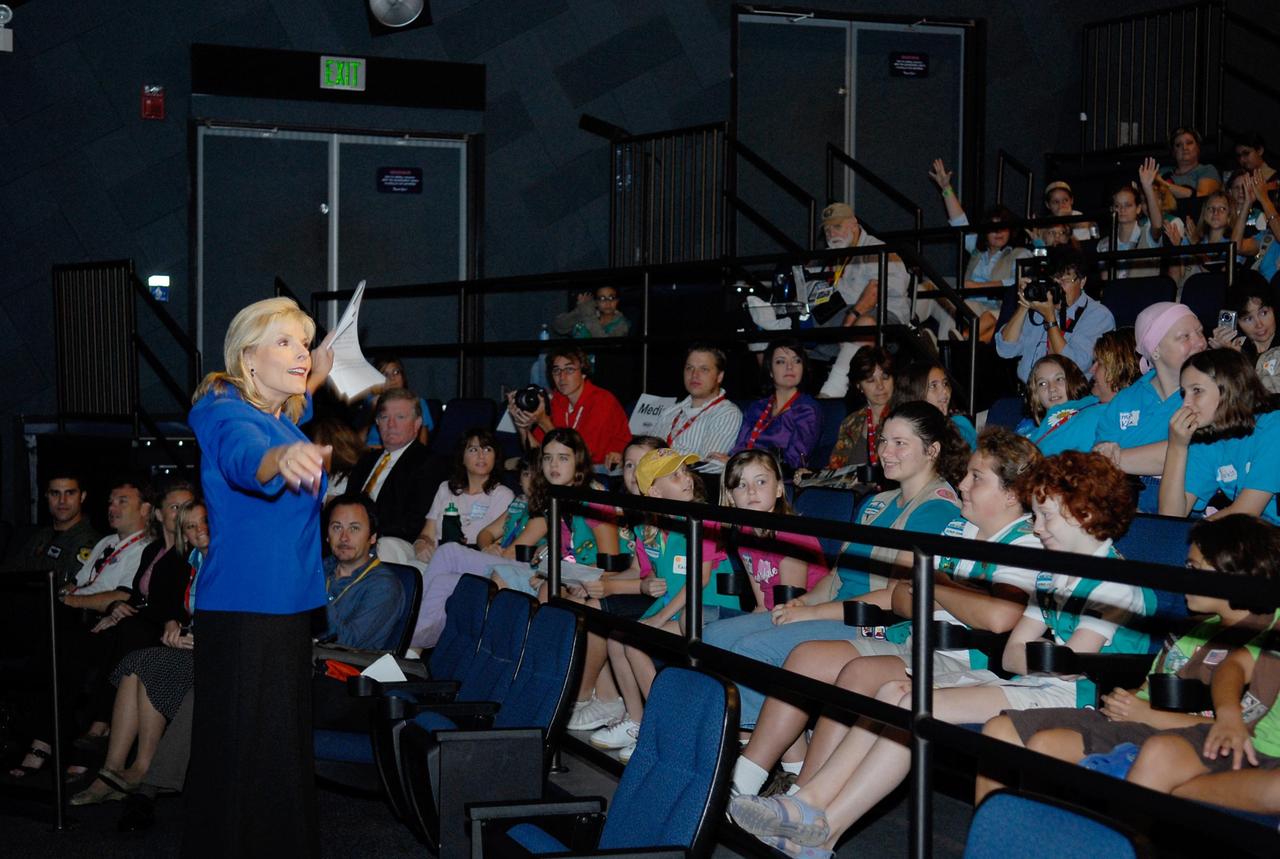 KENNEDY SPACE CENTER, FLA. --  Barbara West, from local ABC affiliate WFTV, talks to the audience of Girl Scouts attending the Pioneering Women of Aerospace forum during the World Space Expo held at NASA's Kennedy Space Center Visitor Complex.  The forum featured Eileen Collins and other prominent female space veterans. The expo commemorates humanity's first 50 years in space while looking forward to returning people to the moon and exploring beyond.  The expo showcased various panels, presentations and educational programs, as well as an aerial salute featuring the U.S. Air Force Thunderbirds, U.S. Air Force F-22 Raptor, U.S. Navy F-18 Super Hornet, U.S. Air Force F-15 Eagle, the P-51 Mustang Heritage Flight, and the U.S. Air Force 920th Rescue Wing, which was responsible for Mercury and Gemini capsule recovery. The U.S. Army Golden Knights also demonstrated precision skydiving. Photo credit: NASA/Kim Shiflett