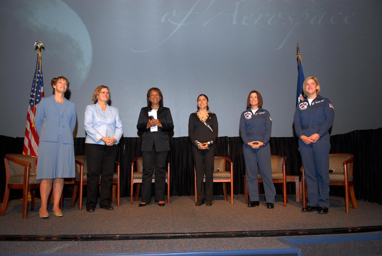 KENNEDY SPACE CENTER, FLA. —  On stage for the World Space Expo's Pioneering Women of Aerospace forum are Ret. Colonel Eileen Collins, the first female shuttle commander; Dr. Kathryn D. Sullivan, the first American woman to spacewalk; Patricia Grace Smith, with the FAA, the first associate administrator of commercial space transportation; Dr. Anousheh Ansari, a spaceflight participant ; Major Nicole Malachowski, the first female pilot with the U.S. Air Force Thunderbirds; and Major Samantha Weeks, the first female solo pilot with the  U.S. Air Force Thunderbirds.  The expo commemorates humanity's first 50 years in space while looking forward to returning people to the moon and exploring beyond.  The expo showcased various panels, presentations and educational programs, as well as an aerial salute featuring the U.S. Air Force Thunderbirds, U.S. Air Force F-22 Raptor, U.S. Navy F-18 Super Hornet, U.S. Air Force F-15 Eagle, the P-51 Mustang Heritage Flight, and the U.S. Air Force 920th Rescue Wing, which was responsible for Mercury and Gemini capsule recovery. The U.S. Army Golden Knights also demonstrated precision skydiving.  Photo credit: NASA/Kim Shiflett
