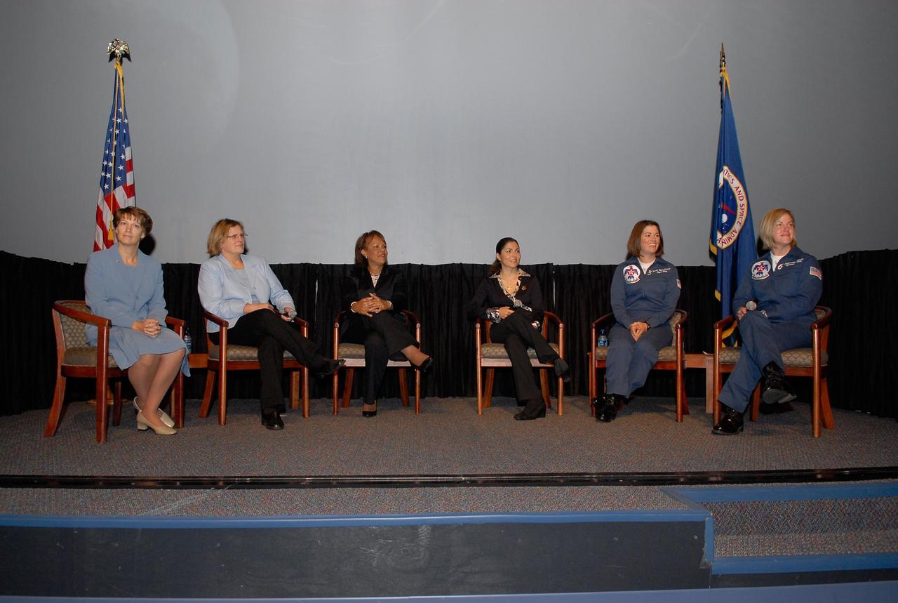 KENNEDY SPACE CENTER, FLA. —  On stage for the World Space Expo's Pioneering Women of Aerospace forum are Ret. Colonel Eileen Collins, the first female shuttle commander; Dr. Kathryn D. Sullivan, the first American woman to spacewalk; Patricia Grace Smith, with the FAA, the first associate administrator of commercial space transportation; Dr. Anousheh Ansari, a spaceflight participant; Major Nicole Malachowski, the first female pilot with the U.S. Air Force Thunderbirds; and Major Samantha Weeks, the first female solo pilot with the  U.S. Air Force Thunderbirds. The expo commemorates humanity's first 50 years in space while looking forward to returning people to the moon and exploring beyond.  The expo showcased various panels, presentations and educational programs, as well as an aerial salute featuring the U.S. Air Force Thunderbirds, U.S. Air Force F-22 Raptor, U.S. Navy F-18 Super Hornet, U.S. Air Force F-15 Eagle, the P-51 Mustang Heritage Flight, and the U.S. Air Force 920th Rescue Wing, which was responsible for Mercury and Gemini capsule recovery. The U.S. Army Golden Knights also demonstrated precision skydiving.  Photo credit: NASA/Kim Shiflett