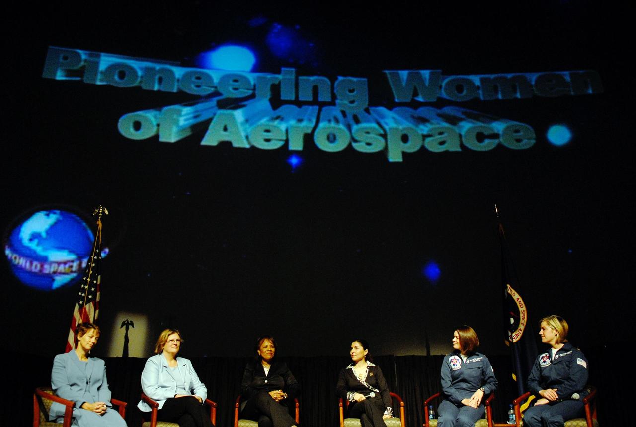 KENNEDY SPACE CENTER, FLA. —  On stage for the World Space Expo's Pioneering Women of Aerospace forum are Ret. Colonel Eileen Collins, the first female shuttle commander; Dr. Kathryn D. Sullivan, the first American woman to spacewalk; Patricia Grace Smith, with the FAA, the first associate administrator of commercial space transportation; Dr. Anousheh Ansari, a spaceflight participant; Major Nicole Malachowski, the first female pilot with the U.S. Air Force Thunderbirds; and Major Samantha Weeks, the first female solo pilot with the  U.S. Air Force Thunderbirds. The expo commemorates humanity's first 50 years in space while looking forward to returning people to the moon and exploring beyond.  The expo showcased various panels, presentations and educational programs, as well as an aerial salute featuring the U.S. Air Force Thunderbirds, U.S. Air Force F-22 Raptor, U.S. Navy F-18 Super Hornet, U.S. Air Force F-15 Eagle, the P-51 Mustang Heritage Flight, and the U.S. Air Force 920th Rescue Wing, which was responsible for Mercury and Gemini capsule recovery. The U.S. Army Golden Knights also demonstrated precision skydiving.  Photo credit: NASA/Kim Shiflett