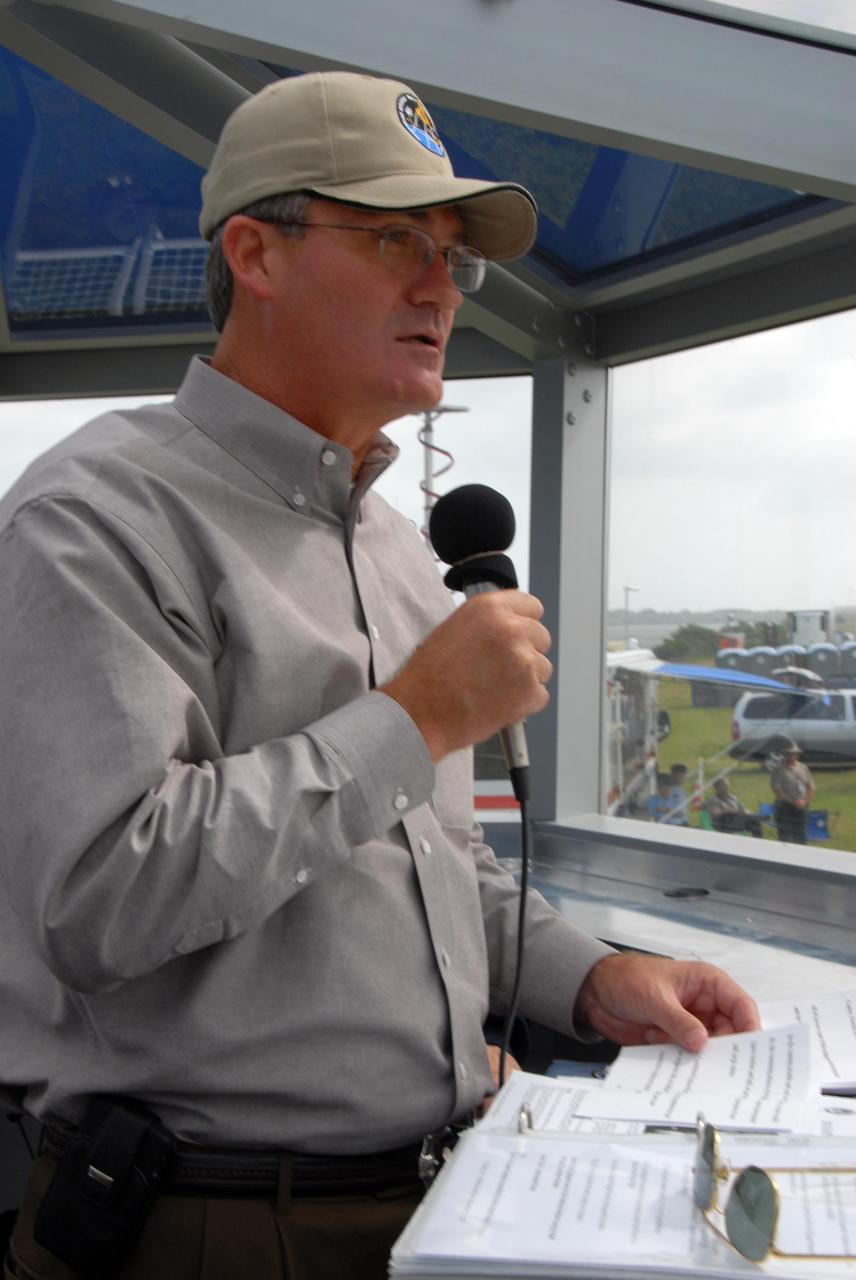 KENNEDY SPACE CENTER, FLA. -- During a rehearsal, Center Director Bill Parsons helps introduce the World Space Expo Aerial Salute at NASA's Kennedy Space Center.  Commemorating humanity's first 50 years in space while looking forward to returning people to the moon and exploring beyond, the expo will showcase various panels, presentations and educational programs, as well as the air show.  Participating in the air show are the U.S. Air Force Thunderbirds, U.S. Air Force F-22 Raptor, U.S. Navy F-18 Super Hornet, U.S. Air Force F-15 Eagle, the P-51 Mustang Heritage Flight, and the U.S. Air Force 920th Rescue Wing, which was responsible for Mercury and Gemini capsule recovery. The U.S. Army Golden Knights will also demonstrate precision skydiving. Photo credit: NASA/George Shelton