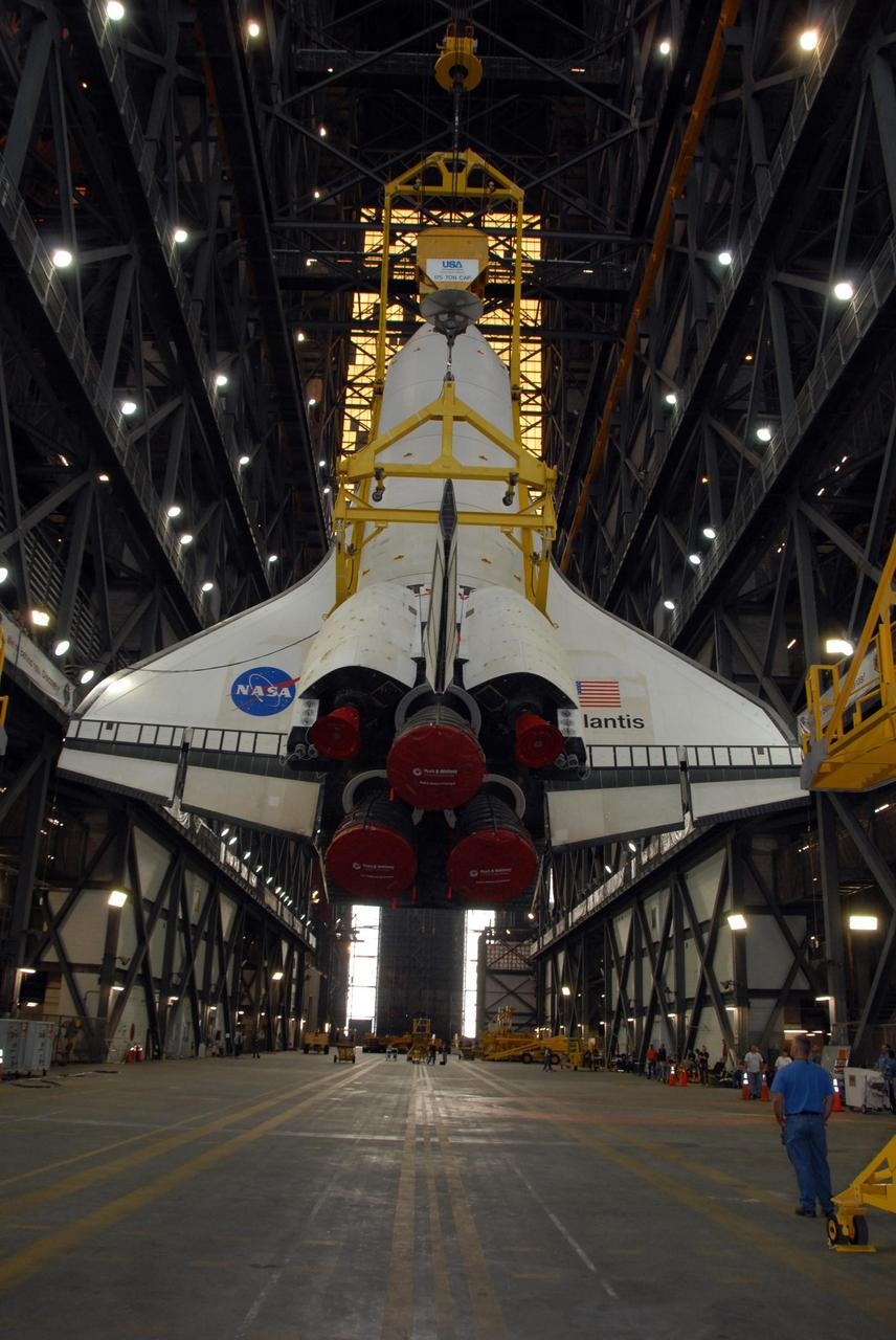 KENNEDY SPACE CENTER, FLA. — In the transfer aisle of the Vehicle Assembly Building at NASA's Kennedy Space Center, space shuttle Atlantis is raised into a vertical position. Atlantis will next be lifted into high bay 3 and mated with the external tank and solid rocket boosters designated for mission STS-122, already secured atop a mobile launcher platform. On this mission, Atlantis will deliver the Columbus module to the International Space Station. The European Space Agency's largest contribution to the station, Columbus is a multifunctional, pressurized laboratory that will be permanently attached to U.S. Node 2, called Harmony. The module is approximately 23 feet long and 15 feet wide, allowing it to hold 10 large racks of experiments. The laboratory will expand the research facilities aboard the station, providing crew members and scientists from around the world the ability to conduct a variety of experiments in the physical, materials and life sciences. Mission STS-122 is targeted for launch on Dec. 6. Photo credit: NASA/George Shelton