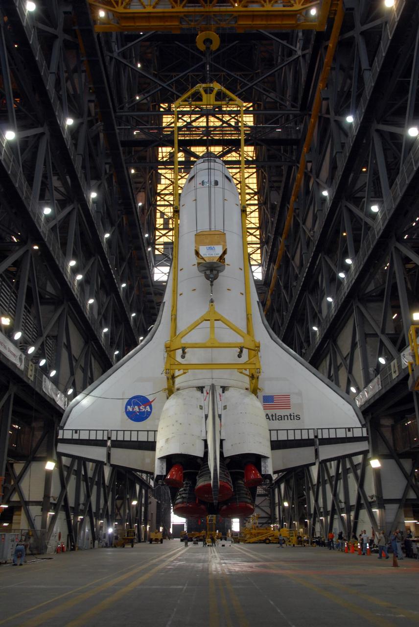 KENNEDY SPACE CENTER, FLA. — In the transfer aisle of the Vehicle Assembly Building at NASA's Kennedy Space Center, space shuttle Atlantis is raised to a nearly vertical position. Atlantis will next be lifted into high bay 3 and mated with the external tank and solid rocket boosters designated for mission STS-122, already secured atop a mobile launcher platform. On this mission, Atlantis will deliver the Columbus module to the International Space Station. The European Space Agency's largest contribution to the station, Columbus is a multifunctional, pressurized laboratory that will be permanently attached to U.S. Node 2, called Harmony. The module is approximately 23 feet long and 15 feet wide, allowing it to hold 10 large racks of experiments. The laboratory will expand the research facilities aboard the station, providing crew members and scientists from around the world the ability to conduct a variety of experiments in the physical, materials and life sciences. Mission STS-122 is targeted for launch on Dec. 6. Photo credit: NASA/George Shelton