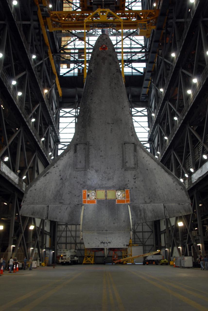 KENNEDY SPACE CENTER, FLA. — Looking like a giant bat, space shuttle Atlantis hangs from an overhead crane over the transfer aisle of the Vehicle Assembly Building at NASA's Kennedy Space Center. Atlantis will next be lifted into high bay 3 and mated with the external tank and solid rocket boosters designated for mission STS-122, already secured atop a mobile launcher platform. On this mission, Atlantis will deliver the Columbus module to the International Space Station. The European Space Agency's largest contribution to the station, Columbus is a multifunctional, pressurized laboratory that will be permanently attached to U.S. Node 2, called Harmony. The module is approximately 23 feet long and 15 feet wide, allowing it to hold 10 large racks of experiments. The laboratory will expand the research facilities aboard the station, providing crew members and scientists from around the world the ability to conduct a variety of experiments in the physical, materials and life sciences. Mission STS-122 is targeted for launch on Dec. 6. Photo credit: NASA/George Shelton