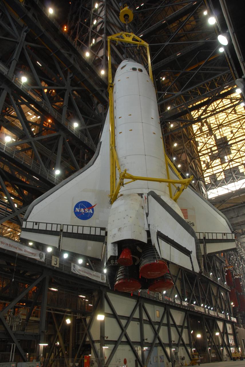 KENNEDY SPACE CENTER, FLA. -- Space shuttle Atlantis is lifted into the upper levels of the Vehicle Assembly Building at NASA's Kennedy Space Center. Atlantis will be lowered into high bay 3 and mated with the external tank and solid rocket boosters designated for mission STS-122, already secured atop a mobile launcher platform. On this mission, Atlantis will deliver the Columbus module to the International Space Station. The European Space Agency's largest contribution to the station, Columbus is a multifunctional, pressurized laboratory that will be permanently attached to U.S. Node 2, called Harmony. The module is approximately 23 feet long and 15 feet wide, allowing it to hold 10 large racks of experiments. The laboratory will expand the research facilities aboard the station, providing crew members and scientists from around the world the ability to conduct a variety of experiments in the physical, materials and life sciences. Mission STS-122 is targeted for launch on Dec. 6. Photo credit: NASA/George Shelton