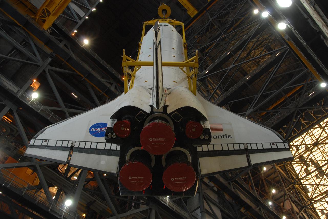 KENNEDY SPACE CENTER, FLA. -- Space shuttle Atlantis is lifted into the upper levels of the Vehicle Assembly Building at NASA's Kennedy Space Center. Atlantis will be lowered into high bay 3 and mated with the external tank and solid rocket boosters designated for mission STS-122, already secured atop a mobile launcher platform. On this mission, Atlantis will deliver the Columbus module to the International Space Station. The European Space Agency's largest contribution to the station, Columbus is a multifunctional, pressurized laboratory that will be permanently attached to U.S. Node 2, called Harmony. The module is approximately 23 feet long and 15 feet wide, allowing it to hold 10 large racks of experiments. The laboratory will expand the research facilities aboard the station, providing crew members and scientists from around the world the ability to conduct a variety of experiments in the physical, materials and life sciences. Mission STS-122 is targeted for launch on Dec. 6.  Photo credit: NASA/George Shelton