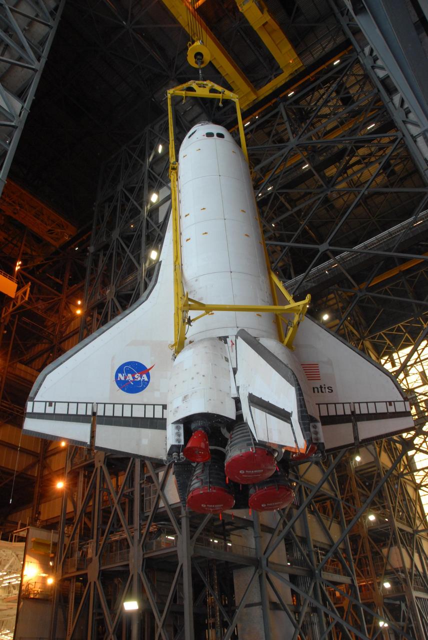 KENNEDY SPACE CENTER, FLA. -- Space shuttle Atlantis is lifted into the upper levels of the Vehicle Assembly Building at NASA's Kennedy Space Center. Atlantis will be lifted into high bay 3 and mated with the external tank and solid rocket boosters designated for mission STS-122, already secured atop a mobile launcher platform. On this mission, Atlantis will deliver the Columbus module to the International Space Station. The European Space Agency's largest contribution to the station, Columbus is a multifunctional, pressurized laboratory that will be permanently attached to U.S. Node 2, called Harmony. The module is approximately 23 feet long and 15 feet wide, allowing it to hold 10 large racks of experiments. The laboratory will expand the research facilities aboard the station, providing crew members and scientists from around the world the ability to conduct a variety of experiments in the physical, materials and life sciences. Mission STS-122 is targeted for launch on Dec. 6. Photo credit: NASA/George Shelton