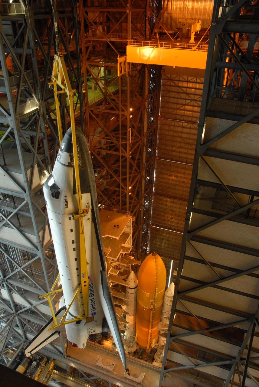 KENNEDY SPACE CENTER, FLA. -- In the upper levels of the Vehicle Assembly Building at NASA's Kennedy Space Center, Space shuttle Atlantis is moved laterally into high bay 3. The external tank and solid rocket boosters can be seen below where they are already secured atop the mobile launcher platform. On this mission, Atlantis will deliver the Columbus module to the International Space Station. The European Space Agency's largest contribution to the station, Columbus is a multifunctional, pressurized laboratory that will be permanently attached to U.S. Node 2, called Harmony. The module is approximately 23 feet long and 15 feet wide, allowing it to hold 10 large racks of experiments. The laboratory will expand the research facilities aboard the station, providing crew members and scientists from around the world the ability to conduct a variety of experiments in the physical, materials and life sciences. Mission STS-122 is targeted for launch on Dec. 6. Photo credit: NASA/George Shelton