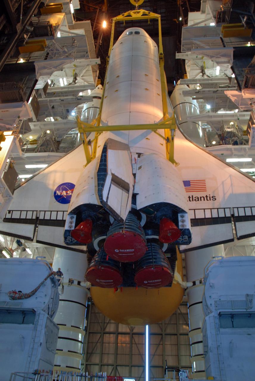 KENNEDY SPACE CENTER, FLA. -- In high bay 3 of the Vehicle Assembly Building at NASA's Kennedy Space Center, space shuttle Atlantis is lowered alongside the external tank and solid rocket boosters waiting below, already secured atop the mobile launcher platform. On this mission, Atlantis will deliver the Columbus module to the International Space Station. The European Space Agency's largest contribution to the station, Columbus is a multifunctional, pressurized laboratory that will be permanently attached to U.S. Node 2, called Harmony. The module is approximately 23 feet long and 15 feet wide, allowing it to hold 10 large racks of experiments. The laboratory will expand the research facilities aboard the station, providing crew members and scientists from around the world the ability to conduct a variety of experiments in the physical, materials and life sciences. Mission STS-122 is targeted for launch on Dec. 6. Photo credit: NASA/George Shelton