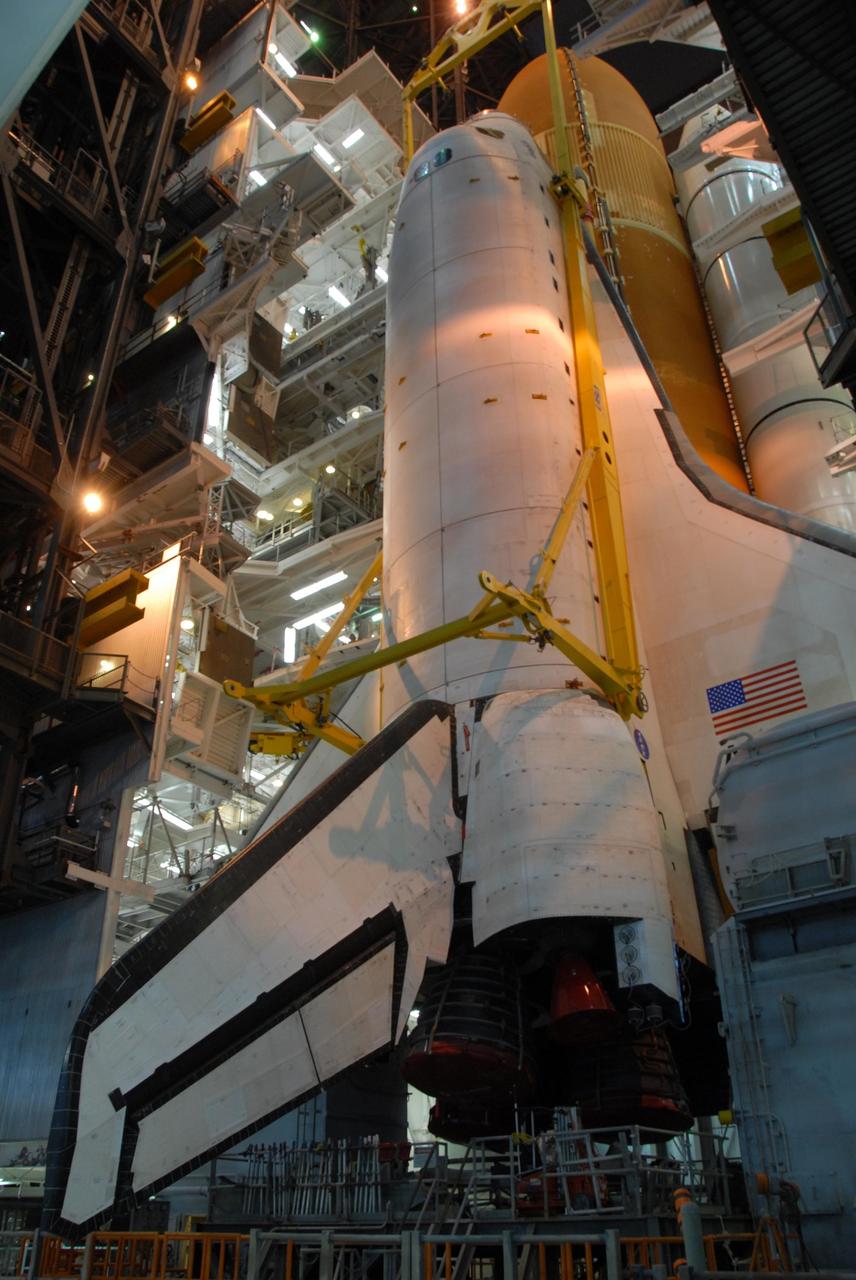 KENNEDY SPACE CENTER, FLA. -- In high bay 3 of the Vehicle Assembly Building at NASA's Kennedy Space Center, space shuttle Atlantis is lowered onto the mobile launcher platform alongside the external tank and solid rocket boosters already secured there. On this mission, Atlantis will deliver the Columbus module to the International Space Station. The European Space Agency's largest contribution to the station, Columbus is a multifunctional, pressurized laboratory that will be permanently attached to U.S. Node 2, called Harmony. The module is approximately 23 feet long and 15 feet wide, allowing it to hold 10 large racks of experiments. The laboratory will expand the research facilities aboard the station, providing crew members and scientists from around the world the ability to conduct a variety of experiments in the physical, materials and life sciences. Mission STS-122 is targeted for launch on Dec. 6. Photo credit: NASA/George Shelton