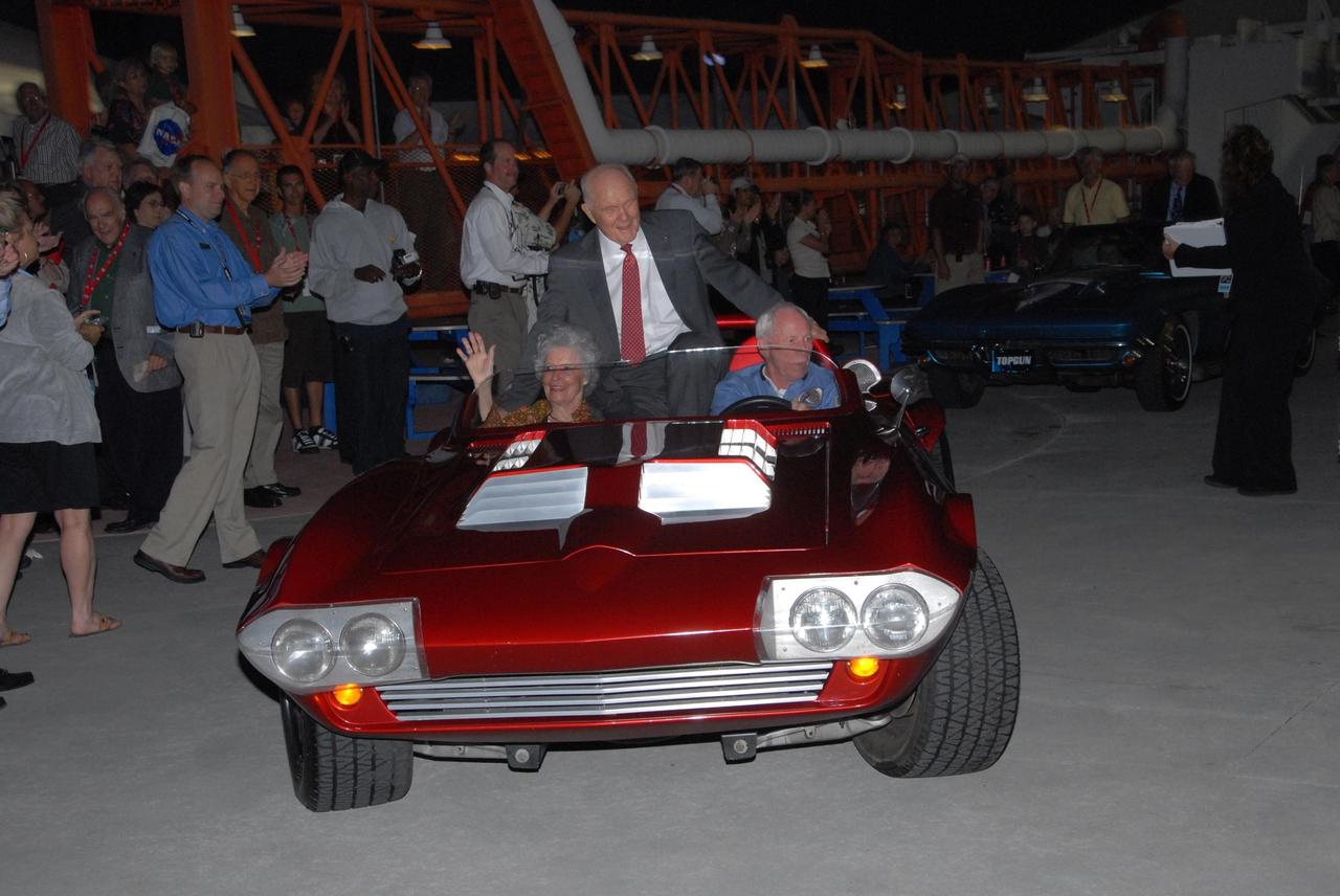 KENNEDY SPACE CENTER, FLA. -- In a cavalcade of veteran Apollo and Mercury astronauts, John Glenn rides in the back of a Corvette driven by Al Worden. On Feb. 20, 1962, John Glenn piloted the Mercury-Atlas 6 "Friendship 7" spacecraft on the first U.S. manned orbital mission. Worden was command module pilot for Apollo 15, July 26-Aug. 7, 1971.  The astronauts were part of the World Space Expo, an event to commemorate humanity's first 50 years in space while looking forward to returning people to the moon and exploring beyond. Commemorating humanity's first 50 years in space while looking forward to returning people to the moon and exploring beyond, the expo showcased various panels, presentations and educational programs, as well as an aerial salute featuring the U.S. Air Force Thunderbirds, U.S. Air Force F-22 Raptor, U.S. Navy F-18 Super Hornet, U.S. Air Force F-15 Eagle, the P-51 Mustang Heritage Flight, and the U.S. Air Force 920th Rescue Wing, which was responsible for Mercury and Gemini capsule recovery. The U.S. Army Golden Knights also demonstrated precision skydiving.  Photo credit: NASA/George Shelton