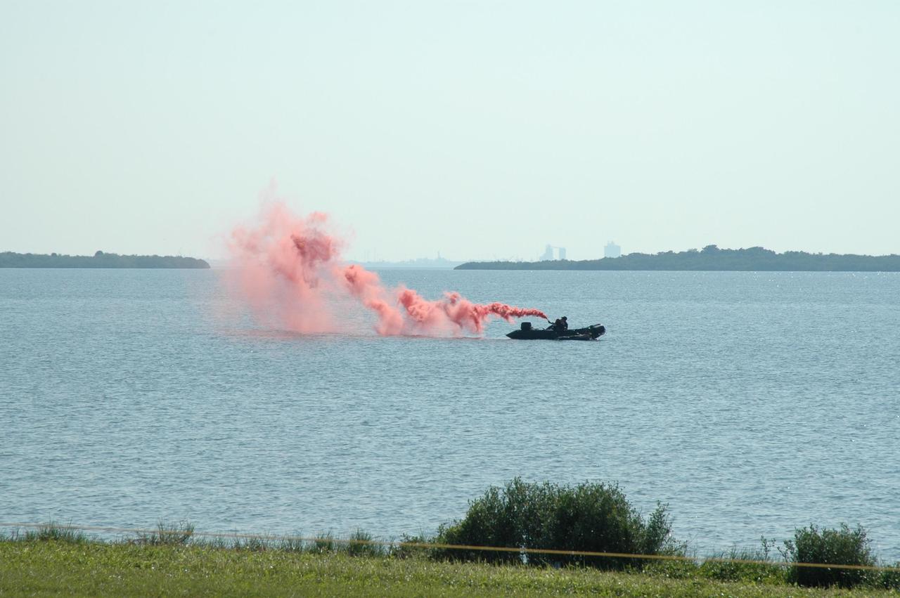 KENNEDY SPACE CENTER, FLA. --  In the water next to the NASA Causeway at NASA's Kennedy Space Center, part of the U.S. Air Force 920th Rescue Wing puts on a demonstration during the World Space Expo aerial salute.  This unit was responsible for Mercury and Gemini capsule recovery.  Other aircraft joining in the expo salute include the U.S. Air Force Thunderbirds Demonstration Squadron, the U.S. Navy F-18 Super Hornets, U.S. Air Force F-22 Raptor,  U.S. Air Force F-15 Eagle, P-51 Mustang Heritage Flight, and the U.S. Army Golden Knights demonstrating precision skydiving. The World Space Expo held Nov. 1-4 was an event commemorating humanity's first 50 years in space while looking forward to returning people to the moon and exploring beyond. The expo showcased various panels, presentations and educational programs. It also was a part of NASA's 50th anniversary celebrations, highlighting the 45th Anniversary of the Mercury Program celebration featuring original NASA astronauts John Glenn and Scott Carpenter and the Pioneering Women of Aerospace forum featuring Eileen Collins and other prominent female space veterans. The agency was founded Oct. 1, 1958.  Photo credit: NASA/Chris Chamberland