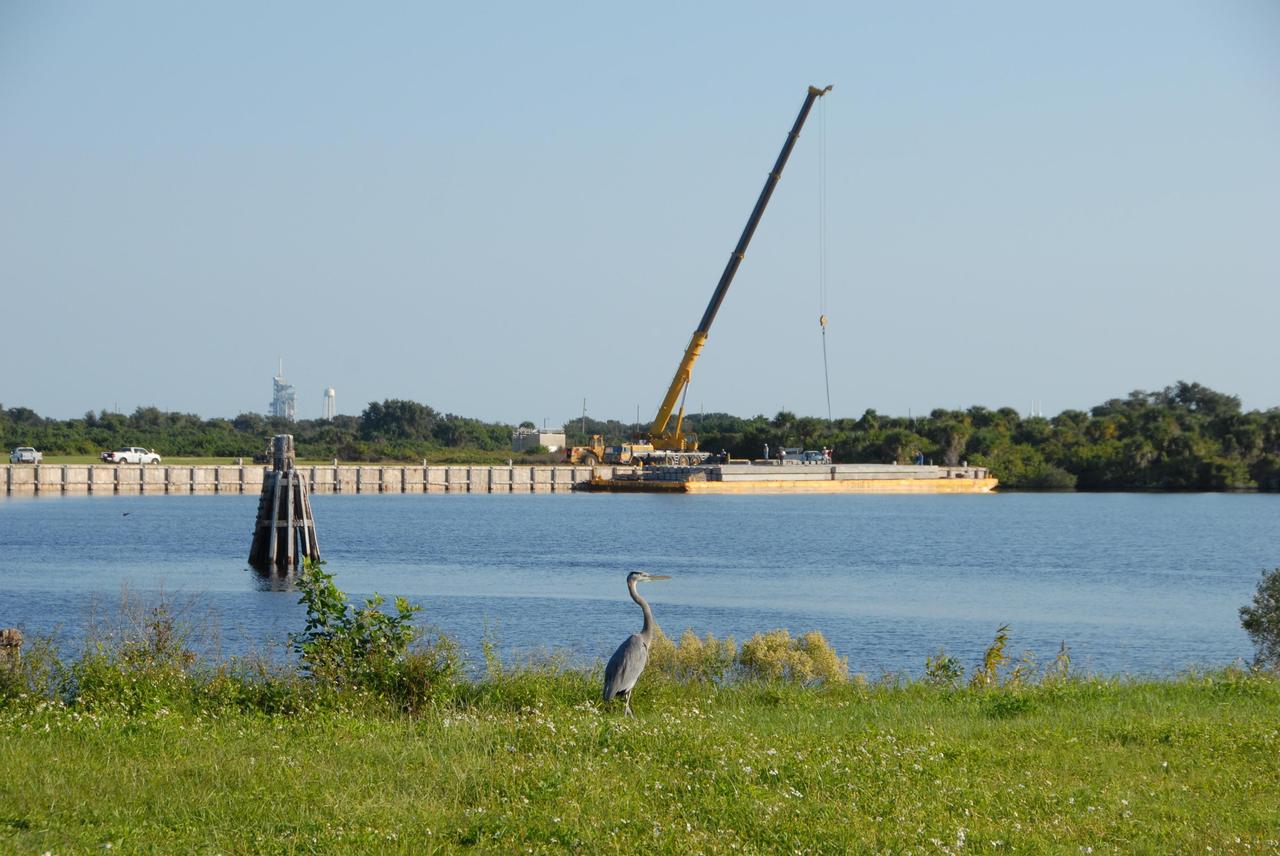 KENNEDY SPACE CENTER, FLA. -- In the Launch Complex 39 Area turn basin at NASA's Kennedy Space Center, the crane crawler is being used to lift pilings from a barge. The pilings will be used to help construct new lightning towers on Launch Pad 39B for the Constellation Program and Ares/Orion launches. Pad B will be the site of the first Ares vehicle launch, including Ares I-X which is scheduled for April 2009. Photo credit: NASA/George Shelton