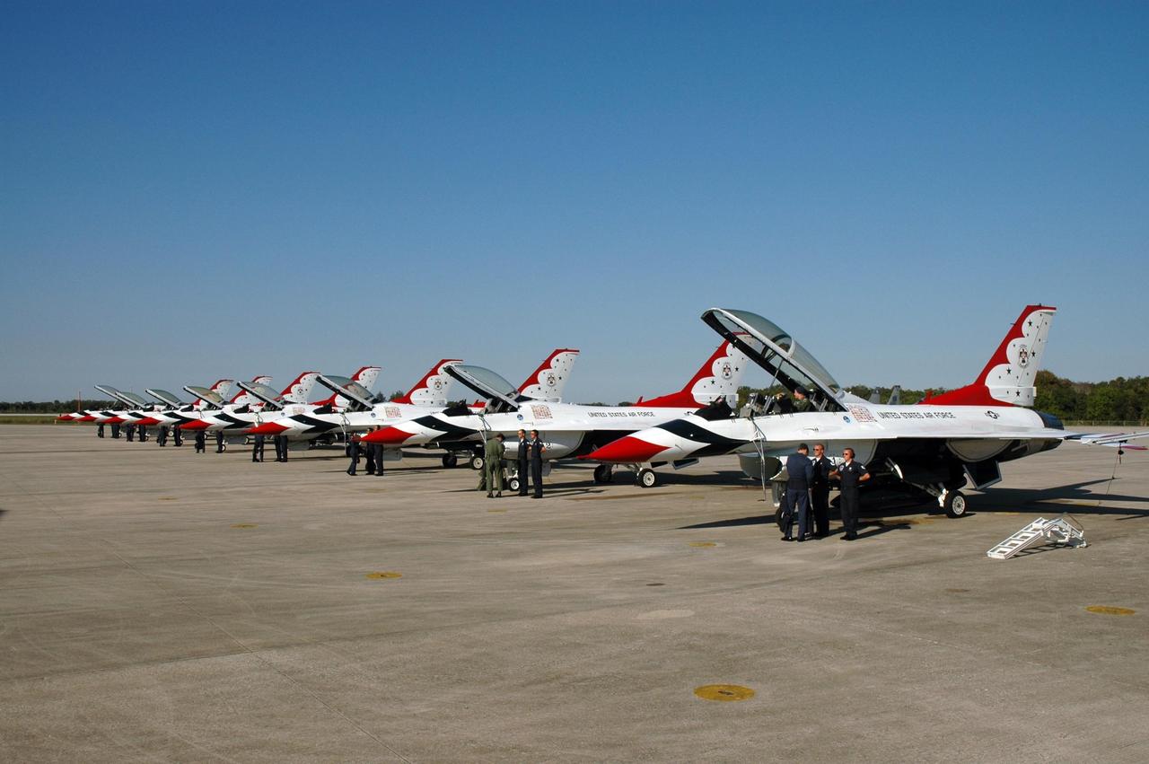 KENNEDY SPACE CENTER, FLA. --   The U.S. Air Force Thunderbirds Demonstration Squadron is lined up on NASA's Kennedy Space Center Shuttle Landing Facility before leaving.  The squadron performed for the World Space Expos' aerial salute along with other aircraft that included the U.S. Navy F-18 Super Hornets, U.S. Air Force F-22 Raptor,  U.S. Air Force F-15 Eagle, P-51 Mustang Heritage Flight, the U.S. Air Force 920th Rescue Wing, which was responsible for Mercury and Gemini capsule recovery, and the U.S. Army Golden Knights precision skydiving team. The World Space Expo held Nov. 1-4 was an event commemorating humanity's first 50 years in space while looking forward to returning people to the moon and exploring beyond. The expo showcased various panels, presentations and educational programs. It also was a part of NASA's 50th anniversary celebrations, highlighting the 45th Anniversary of the Mercury Program celebration featuring original NASA astronauts John Glenn and Scott Carpenter and the Pioneering Women of Aerospace forum featuring Eileen Collins and other prominent female space veterans. The agency was founded Oct. 1, 1958.   Photo credit: NASA/Jim Grossmann
