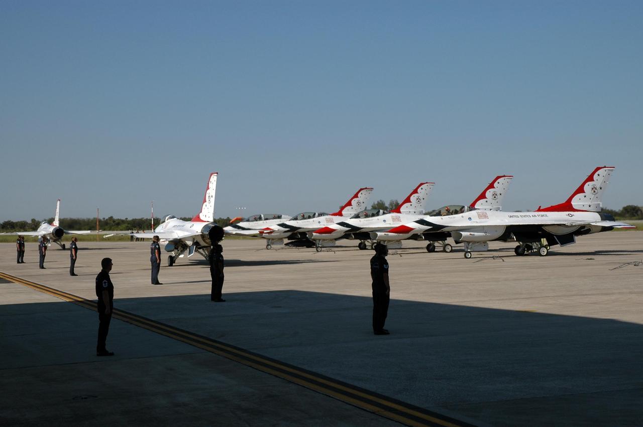 KENNEDY SPACE CENTER, FLA. --  The air crew for the U.S. Air Force Thunderbirds Demonstration Squadron show their precision formation as the planes prepare to take off from NASA's Kennedy Space Center.  The squadron performed for the World Space Expos' aerial salute along with other aircraft that included the U.S. Navy F-18 Super Hornets, U.S. Air Force F-22 Raptor,  U.S. Air Force F-15 Eagle, P-51 Mustang Heritage Flight, the U.S. Air Force 920th Rescue wing, which was responsible for Mercury and Gemini capsule recovery, and the U.S. Army Golden Knights precision skydiving team.  The World Space Expo held Nov. 1-4 was an event commemorating humanity's first 50 years in space while looking forward to returning people to the moon and exploring beyond. The expo showcased various panels, presentations and educational programs. It also was a part of NASA's 50th anniversary celebrations, highlighting the 45th Anniversary of the Mercury Program celebration featuring original NASA astronauts John Glenn and Scott Carpenter and the Pioneering Women of Aerospace forum featuring Eileen Collins and other prominent female space veterans. The agency was founded Oct. 1, 1958.   Photo credit: NASA/Jim Grossmann