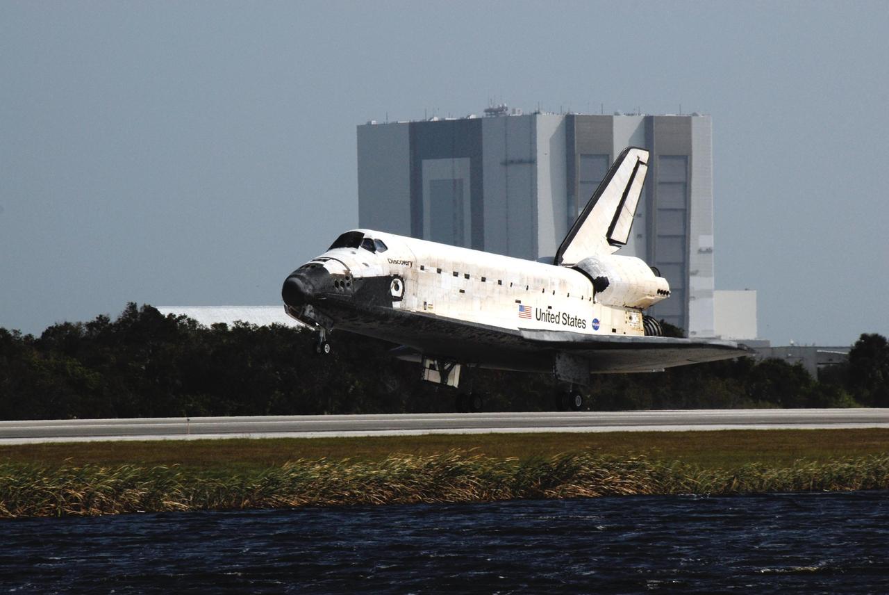 KENNEDY SPACE CENTER, FLA. -- After a 15-day mission to the International Space Station, space shuttle Discovery glides to a smooth landing on Runway 33 of the Shuttle Landing Facility at NASA's Kennedy Space Center at 1:01 p.m. EST on Nov. 7, completing mission STS-120. Main gear touchdown was 1:01:16 p.m. Wheel stop was at 1:02:07 p.m. Mission elapsed time was 15 days, 2 hours, 24 minutes and 2 seconds. The STS-120 crew continued the construction of the station with the installation of the Harmony Node 2 module and the relocation of the P6 truss. Photo credit: NASA/Kim Shiflett