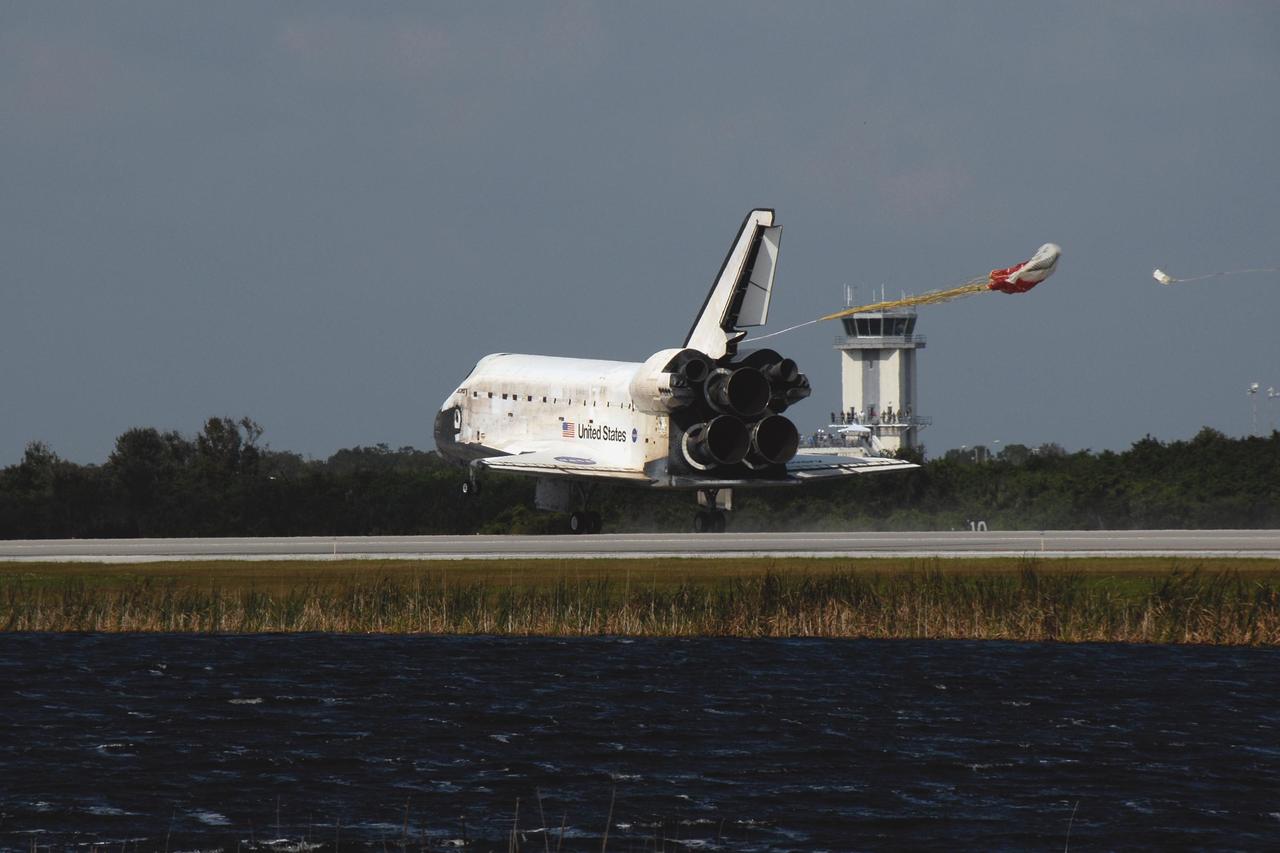 KENNEDY SPACE CENTER, FLA. -- The drag chute is deployed behind space shuttle Discovery to help slow its landing on Runway 33 of the Shuttle Landing Facility at NASA's Kennedy Space Center at 1:01 p.m. EST on Nov. 7, completing the 15-day mission STS-120.  Main gear touchdown was 1:01:16 p.m.  Wheel stop was at 1:02:07 p.m.  Mission elapsed time was 15 days, 2 hours, 24 minutes and 2 seconds. The STS-120 crew continued the construction of the station with the installation of the Harmony Node 2 module and the relocation of the P6 truss. Photo credit: NASA/Kim Shiflett