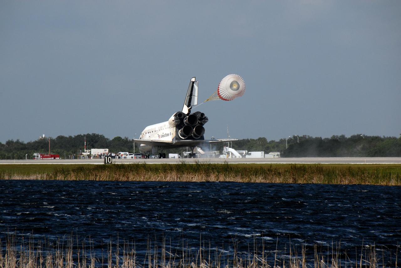 KENNEDY SPACE CENTER, FLA. -- The drag chute is deployed behind space shuttle Discovery to help slow its landing on Runway 33 of the Shuttle Landing Facility at NASA's Kennedy Space Center at 1:01 p.m. EST on Nov. 7, completing the 15-day mission STS-120.  Main gear touchdown was 1:01:16 p.m.  Wheel stop was at 1:02:07 p.m.  Mission elapsed time was 15 days, 2 hours, 24 minutes and 2 seconds. The STS-120 crew continued the construction of the station with the installation of the Harmony Node 2 module and the relocation of the P6 truss. Photo credit: NASA/Kim Shiflett